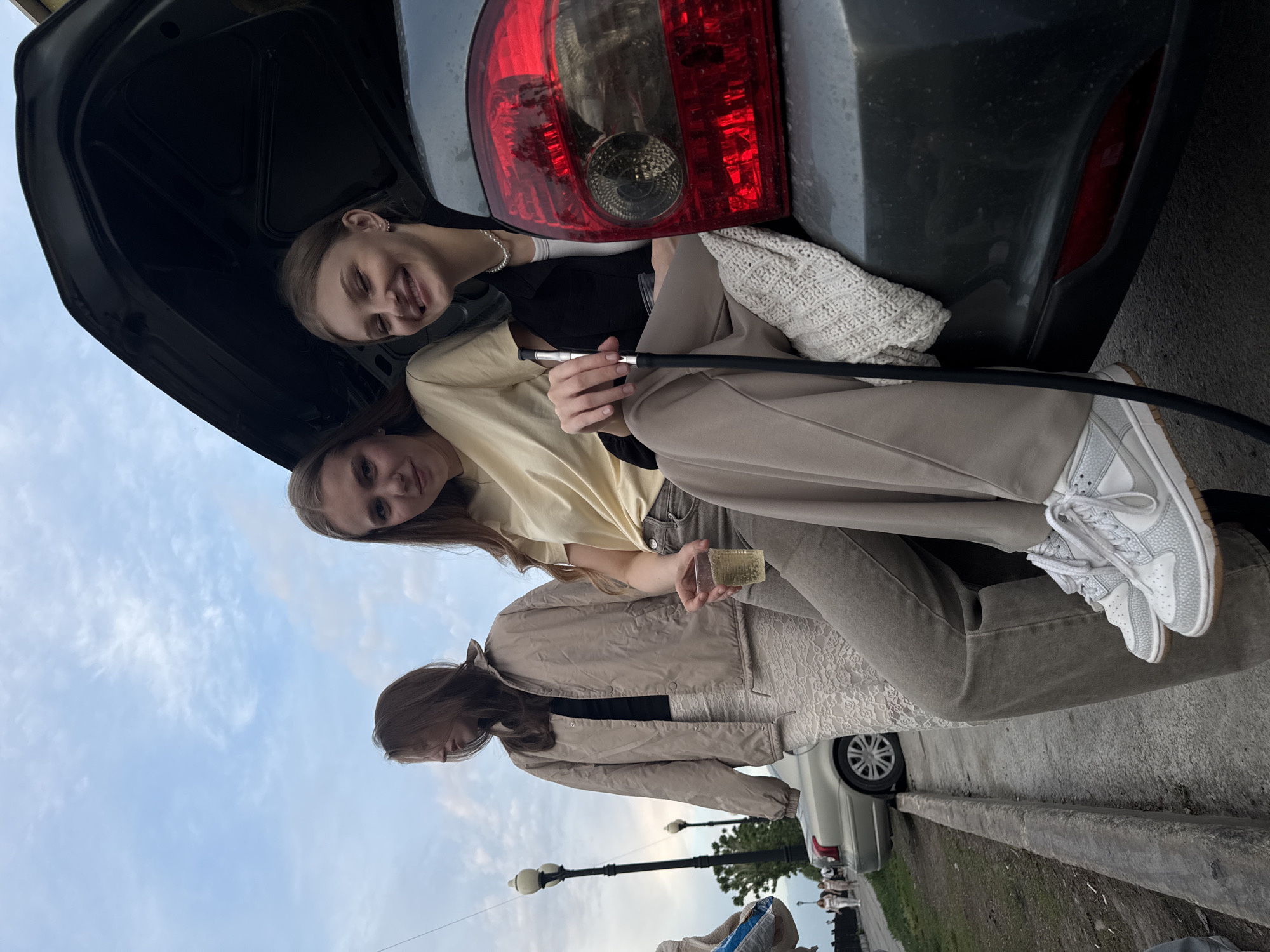Young adults gather for casual outdoor socializing in Perm