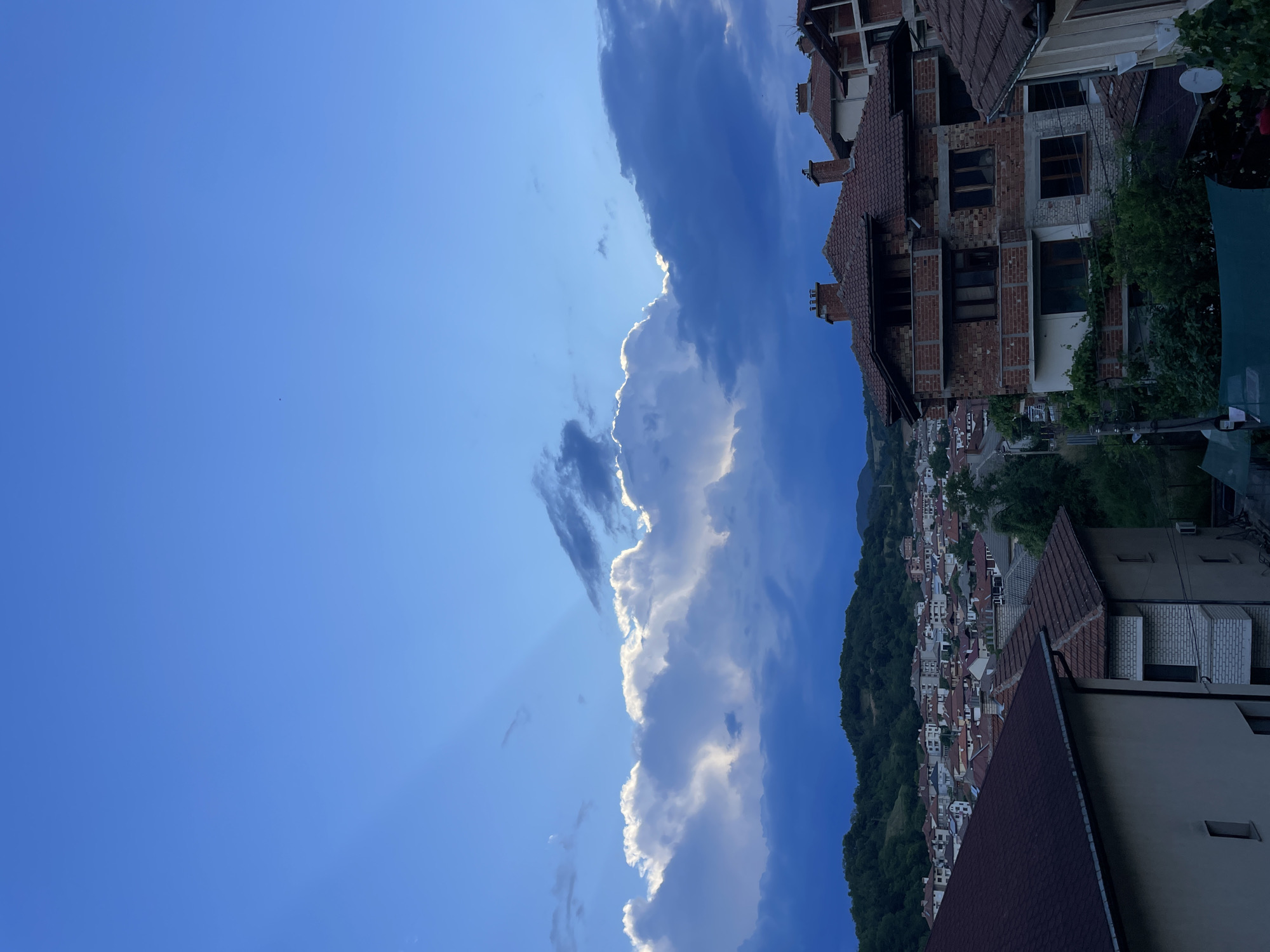 Zlatograd hillside town under a shifting late-afternoon sky