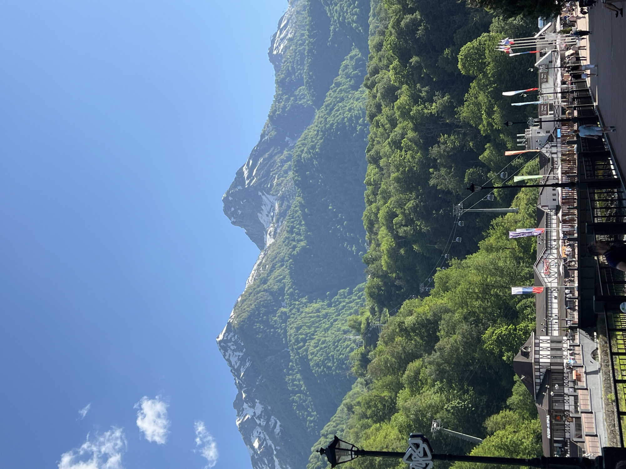 Tourist documents scenic mountain resort with sculptures in Estosadok
