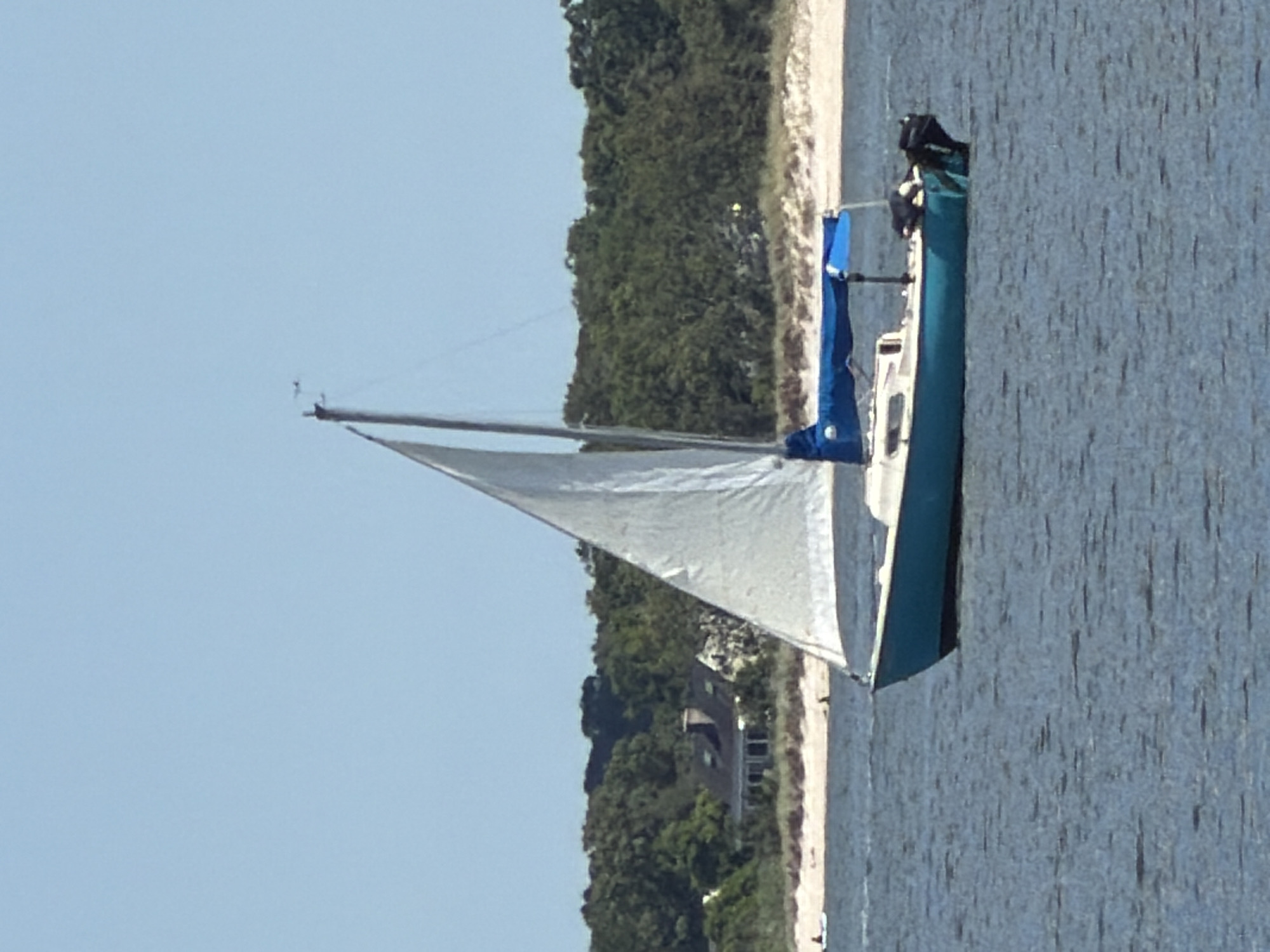 Afternoon on the water in Riverhead, boats and beach in midsummer