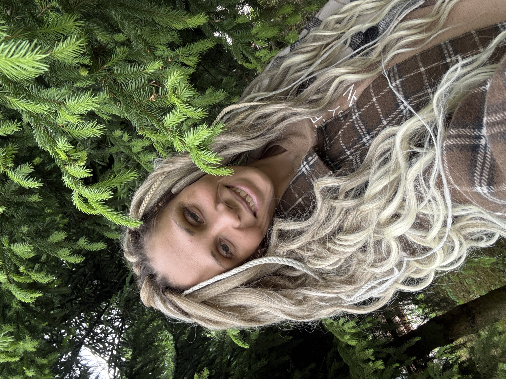 Woman photographed smiling in wooded area near Rusanovo, Russia