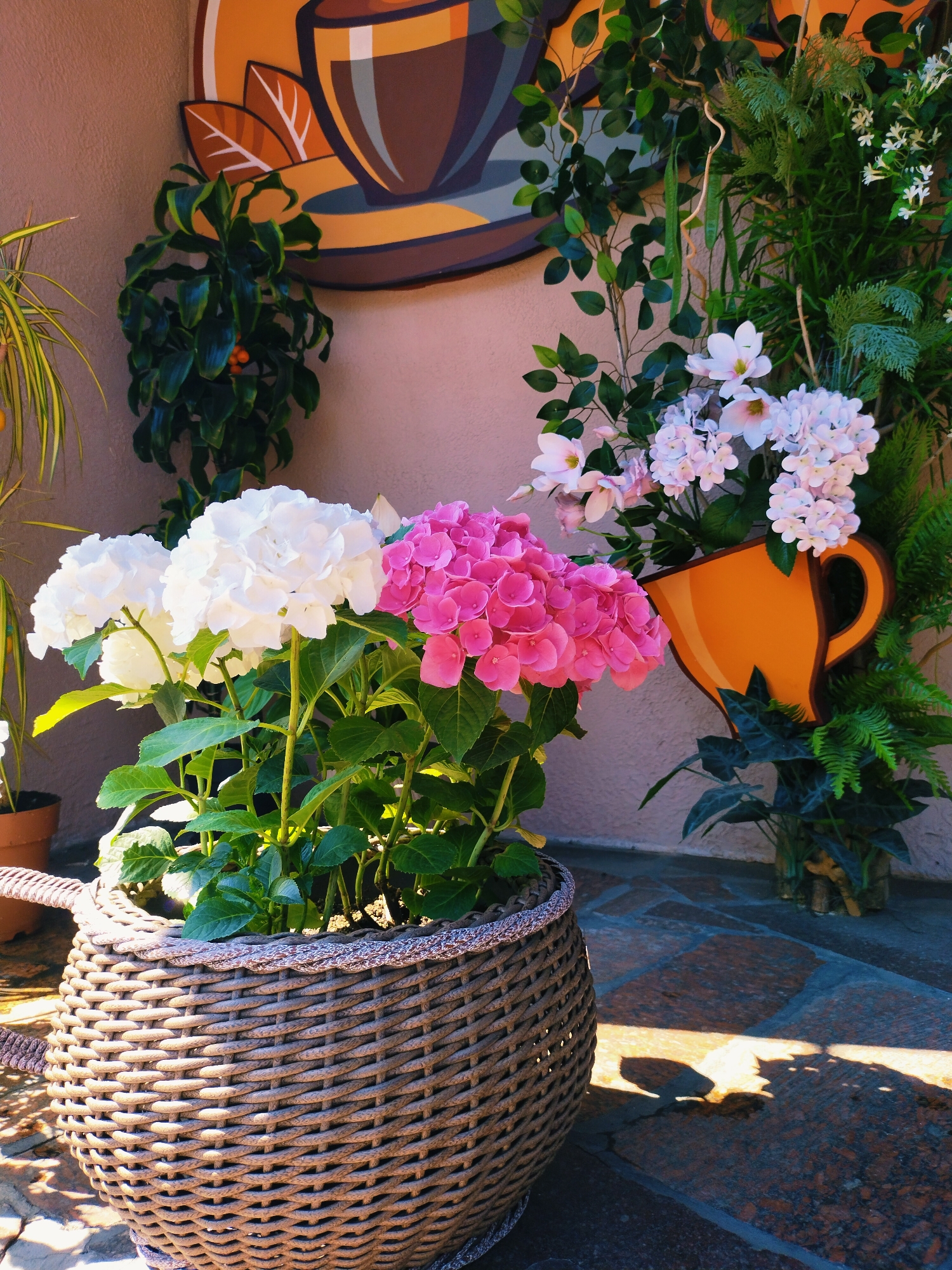 Flower-filled cafe terrace in Horishni Plavni on a summer morning