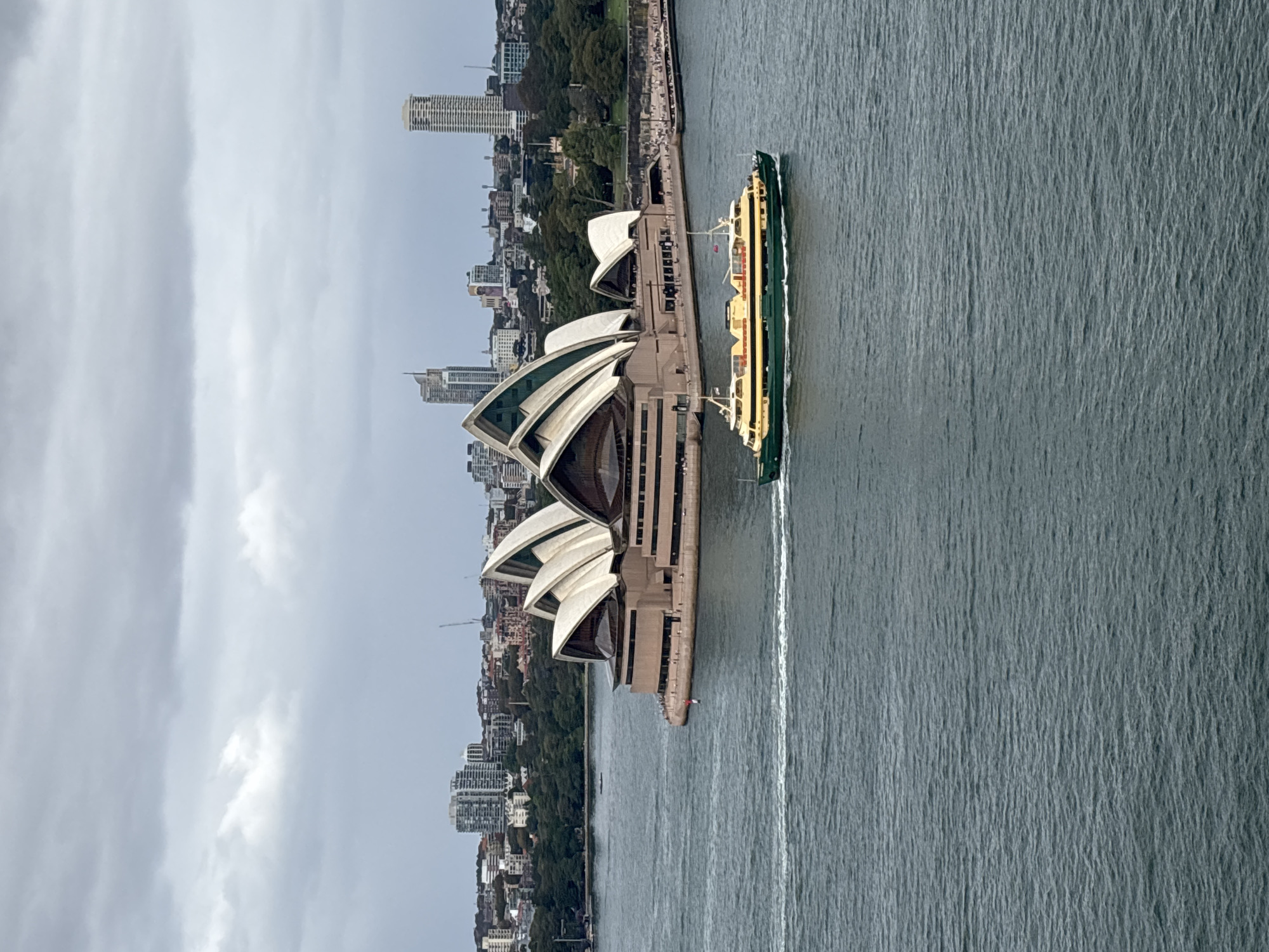 Ferry operates near Sydney Opera House during early morning hours