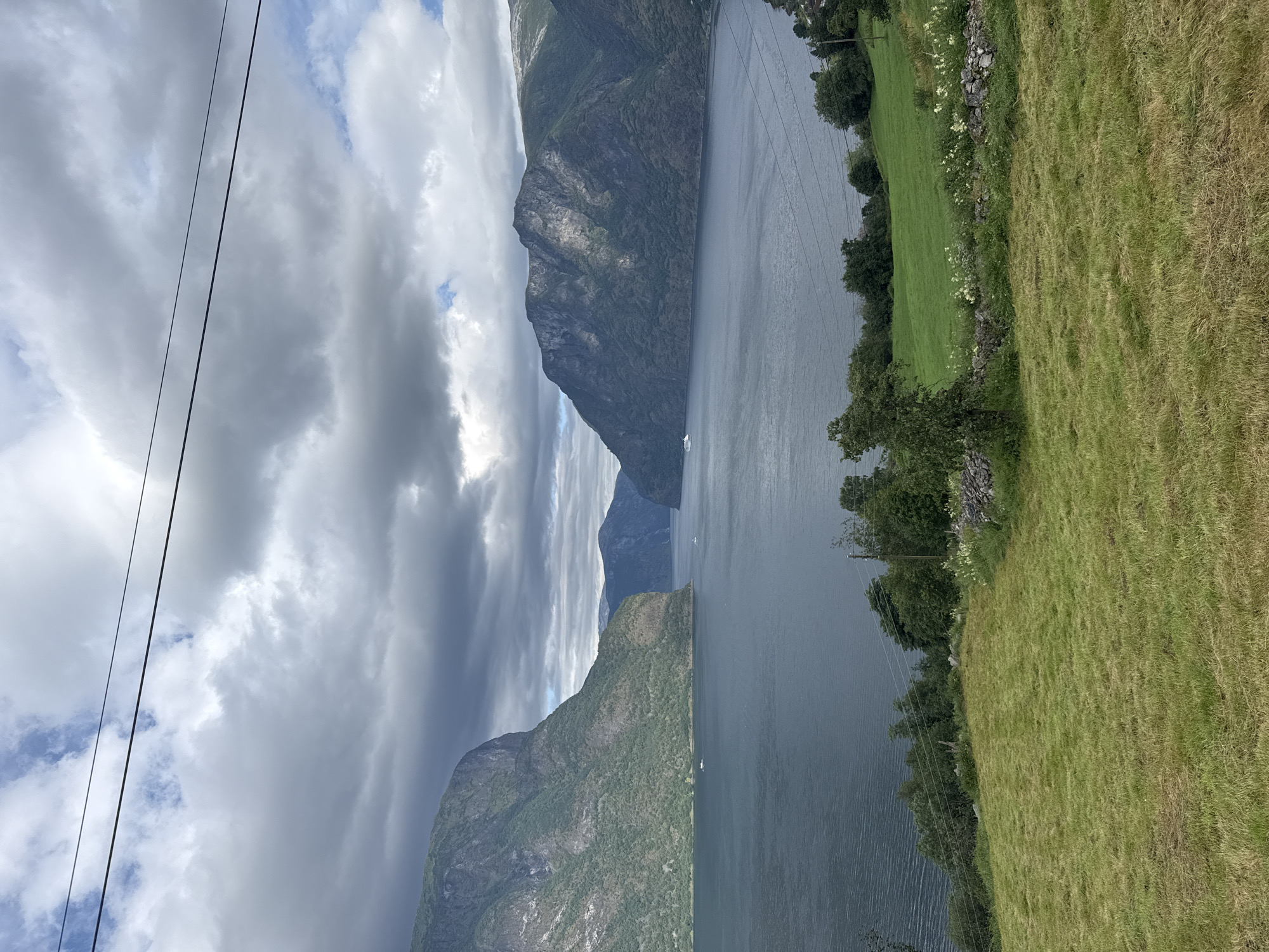 Still waters and cloud-draped peaks along Aurlandsfjord