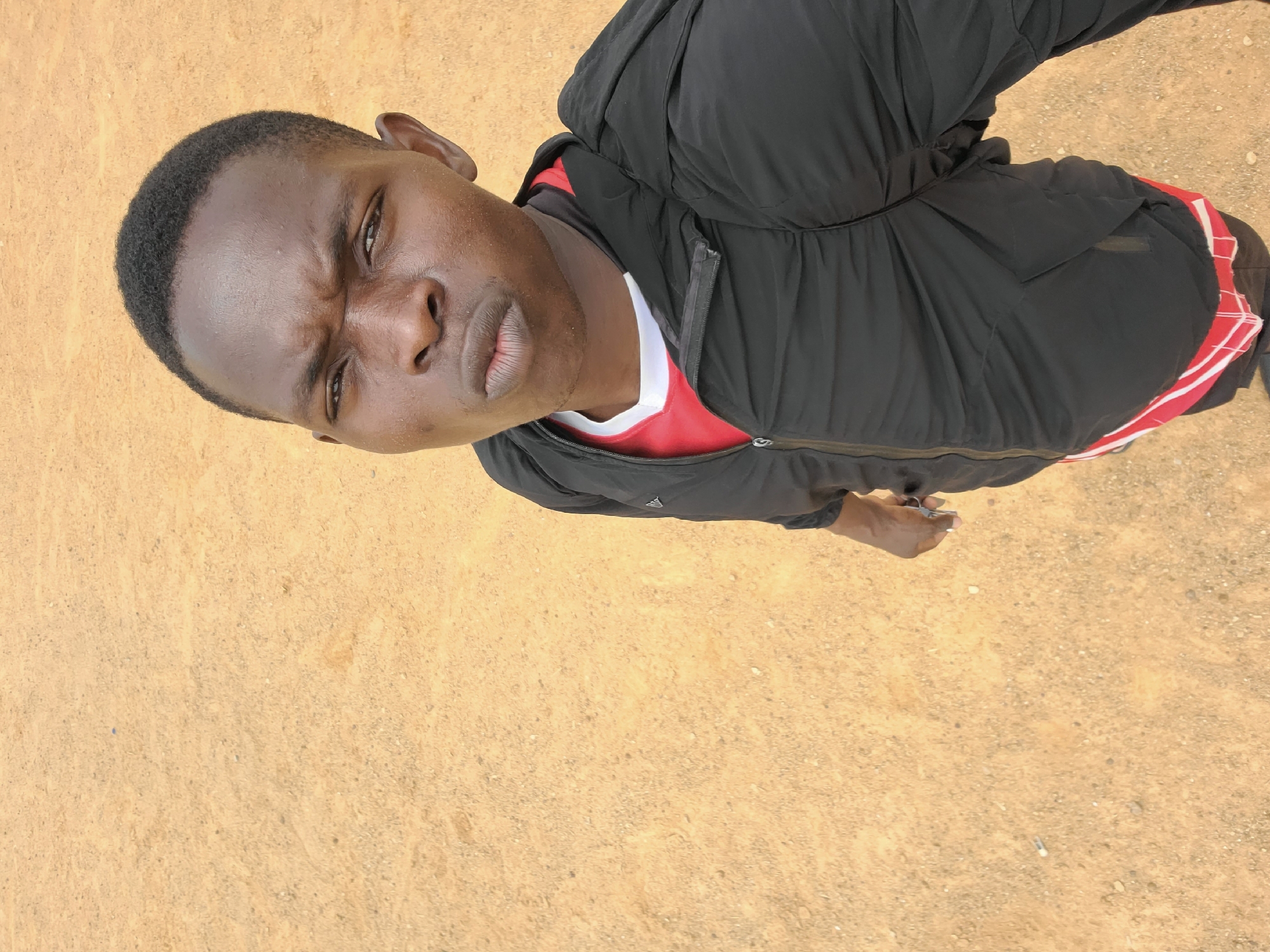Young men gather for recreational activities in Bukuru field