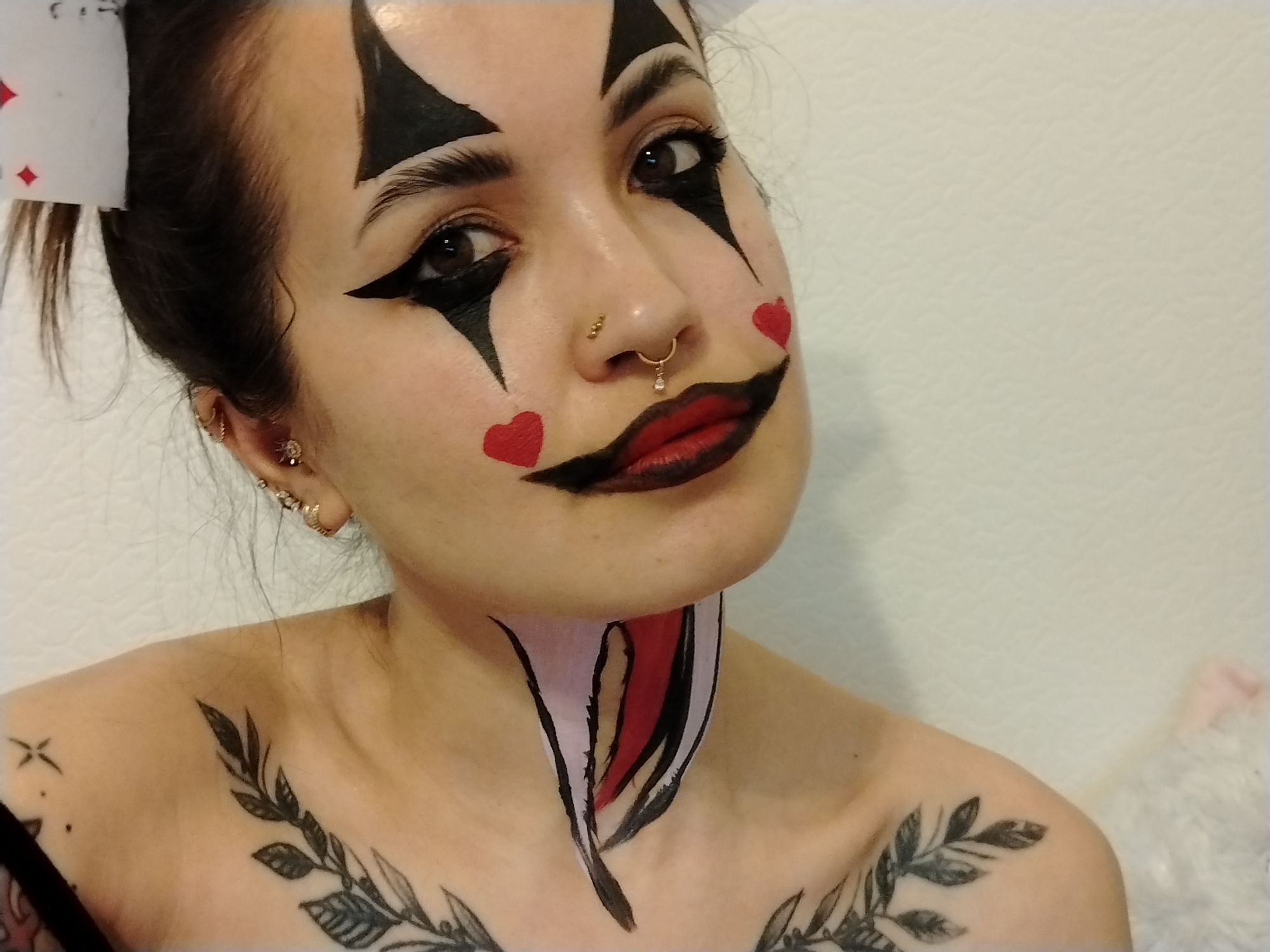 Woman poses in theatrical clown makeup in Noviy, Russia
