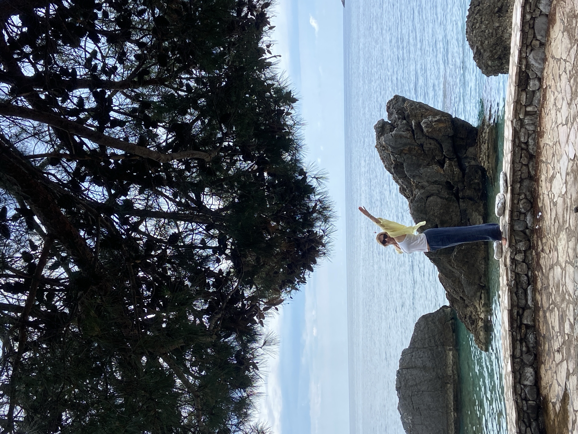 Woman spends morning posing, relaxing along Prijevor Montenegro coastline