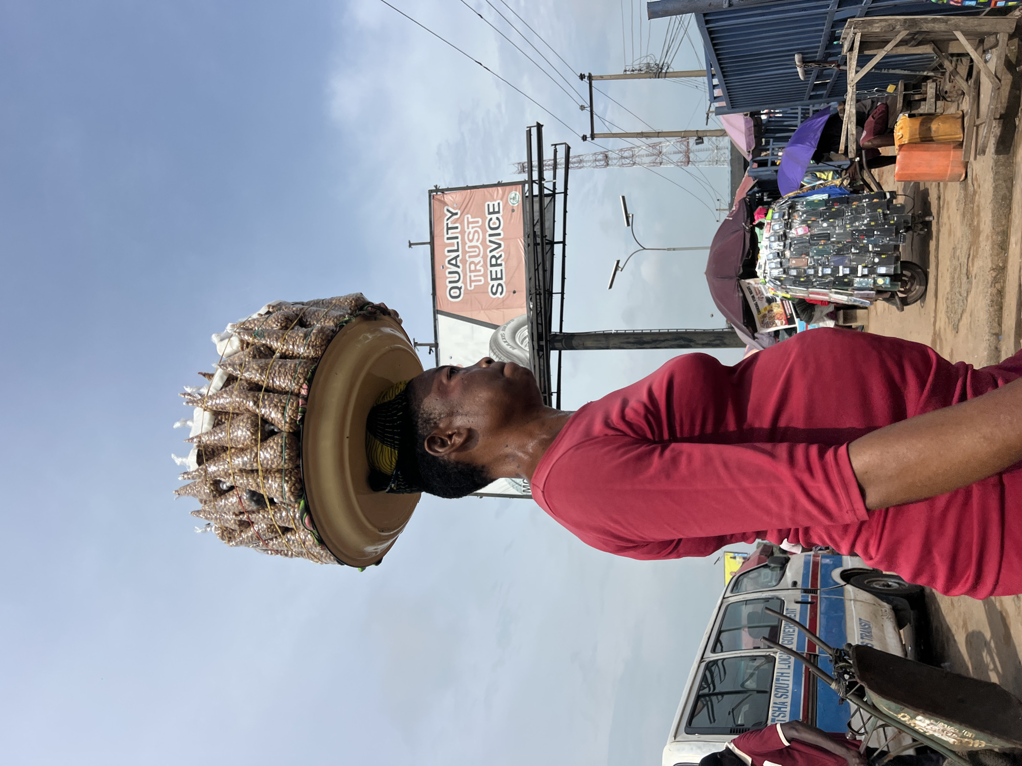 Morning street commerce and transit activity in Onitsha, Nigeria