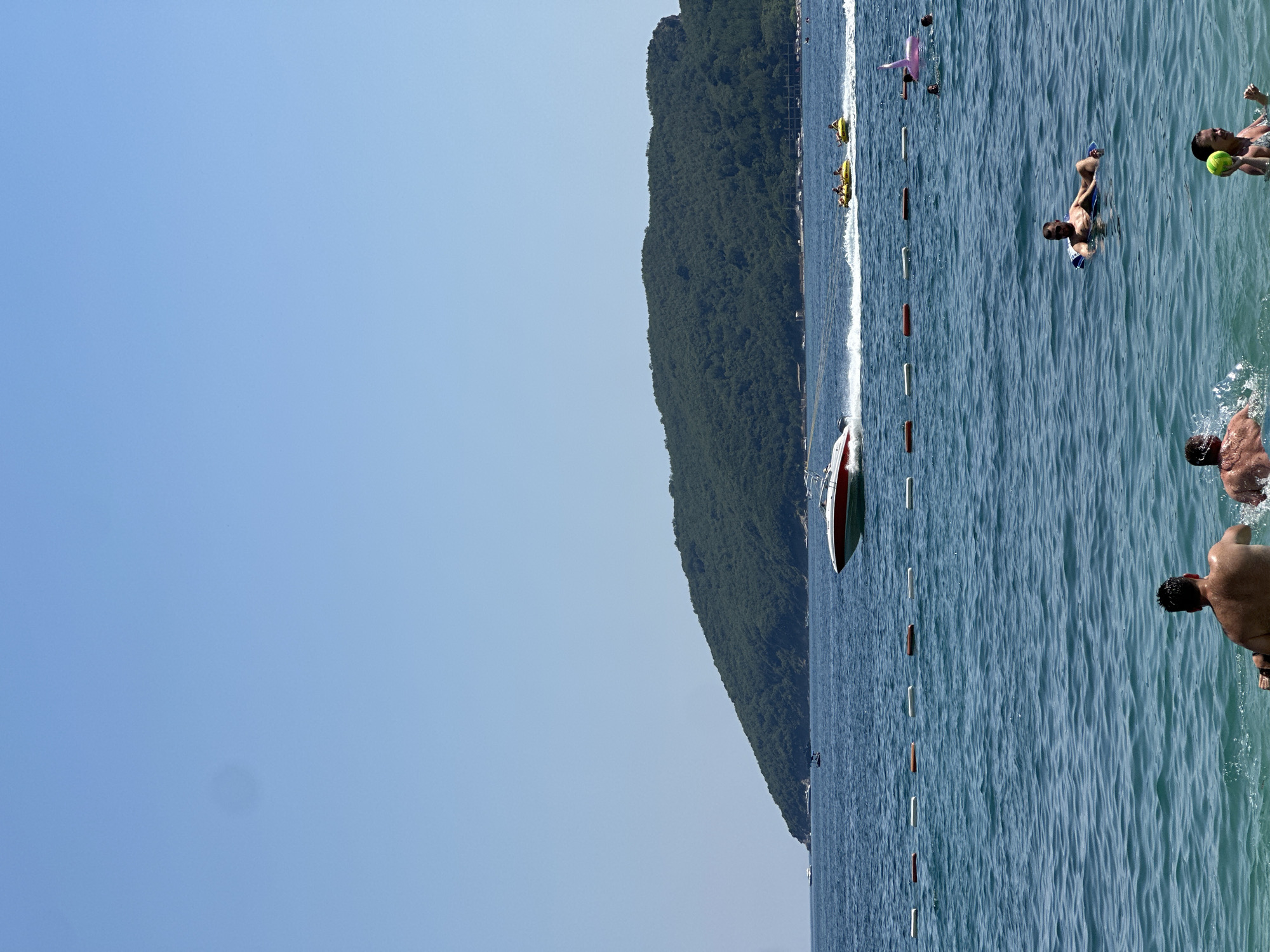 Crowded summer beach day on the Adriatic coast in Budva