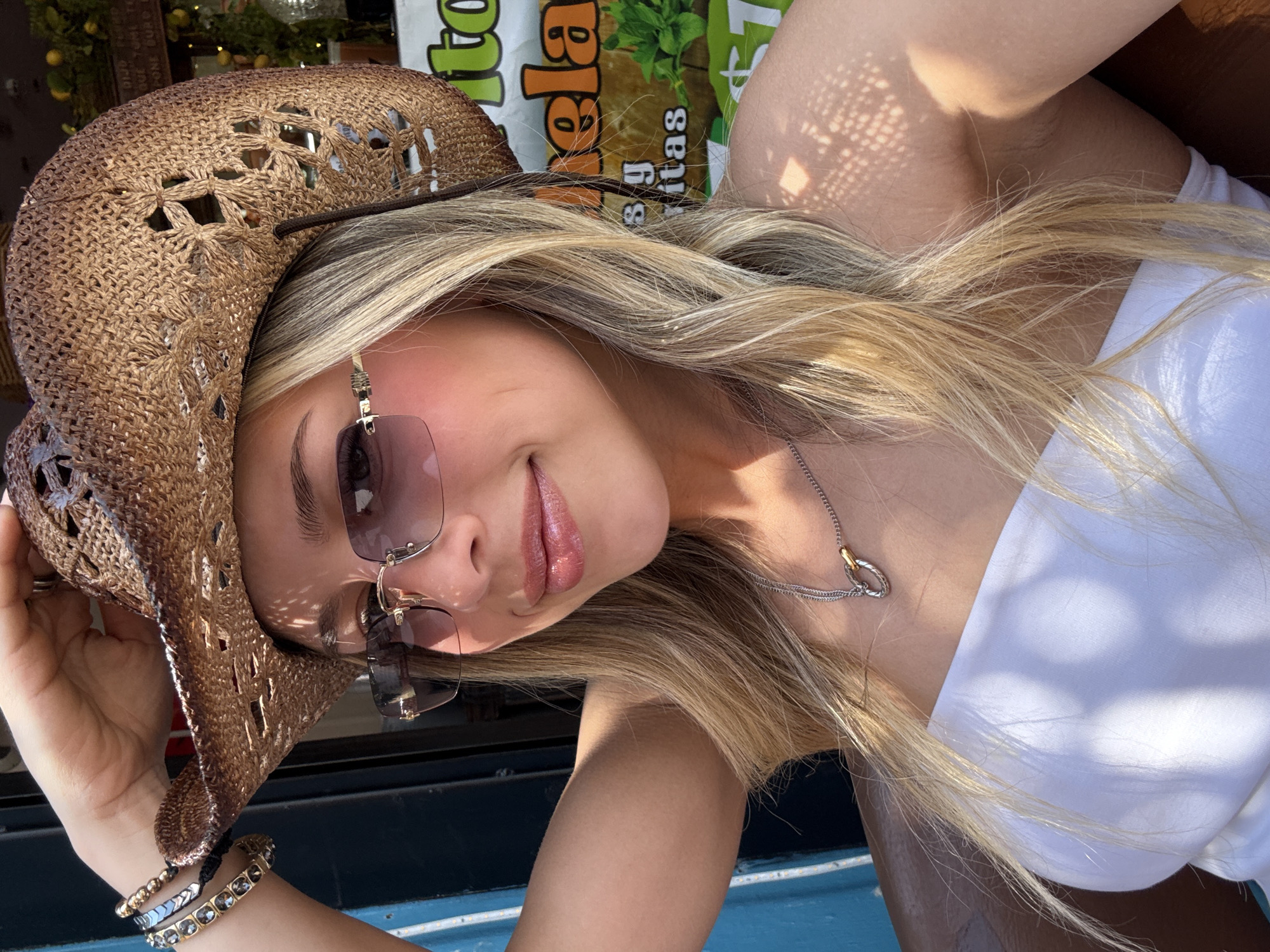 Tourist takes selfies at restaurant patio in Tlaquepaque