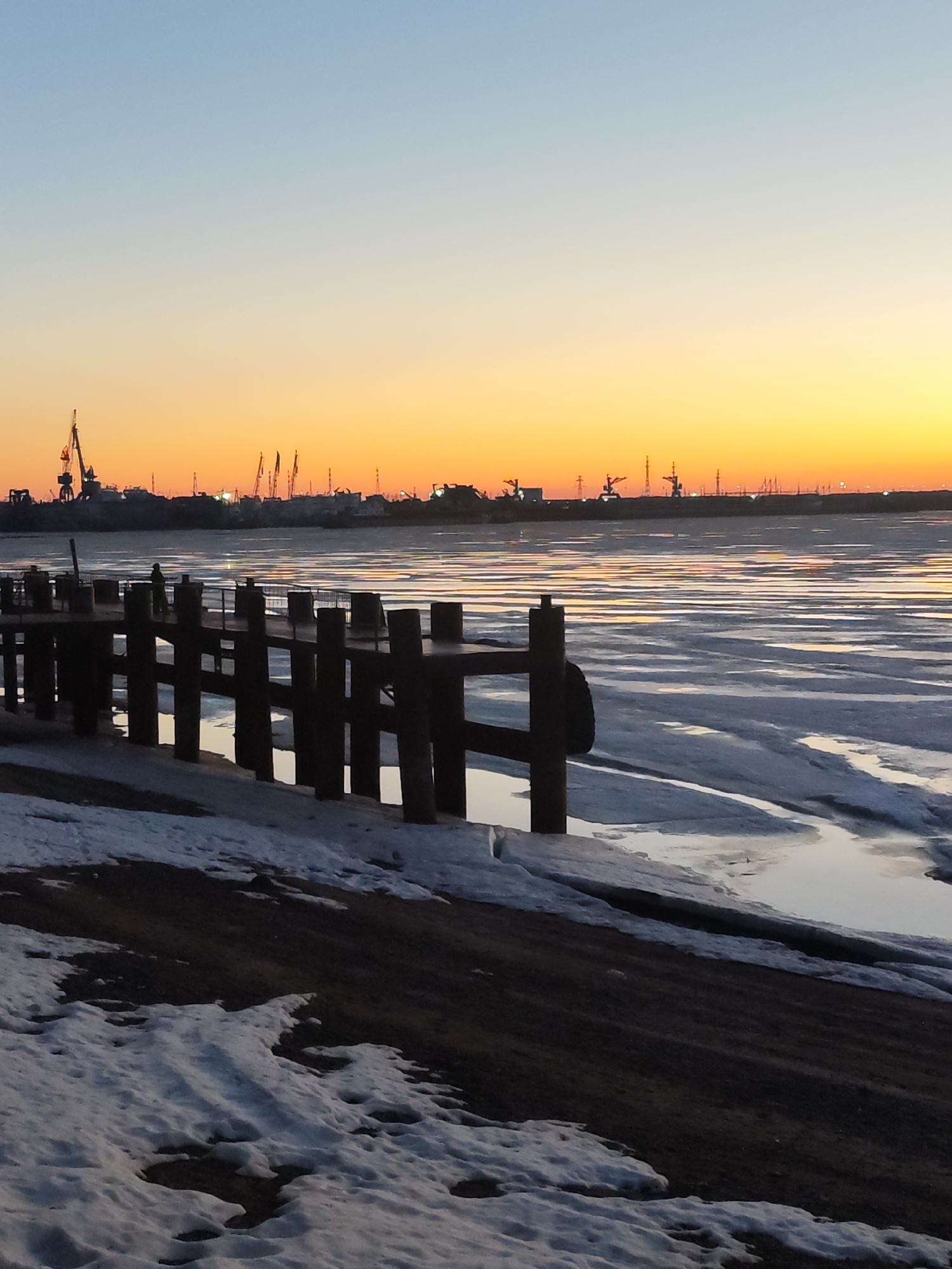 Winter sunset captured over Kama River in Chaikovsky, Russia