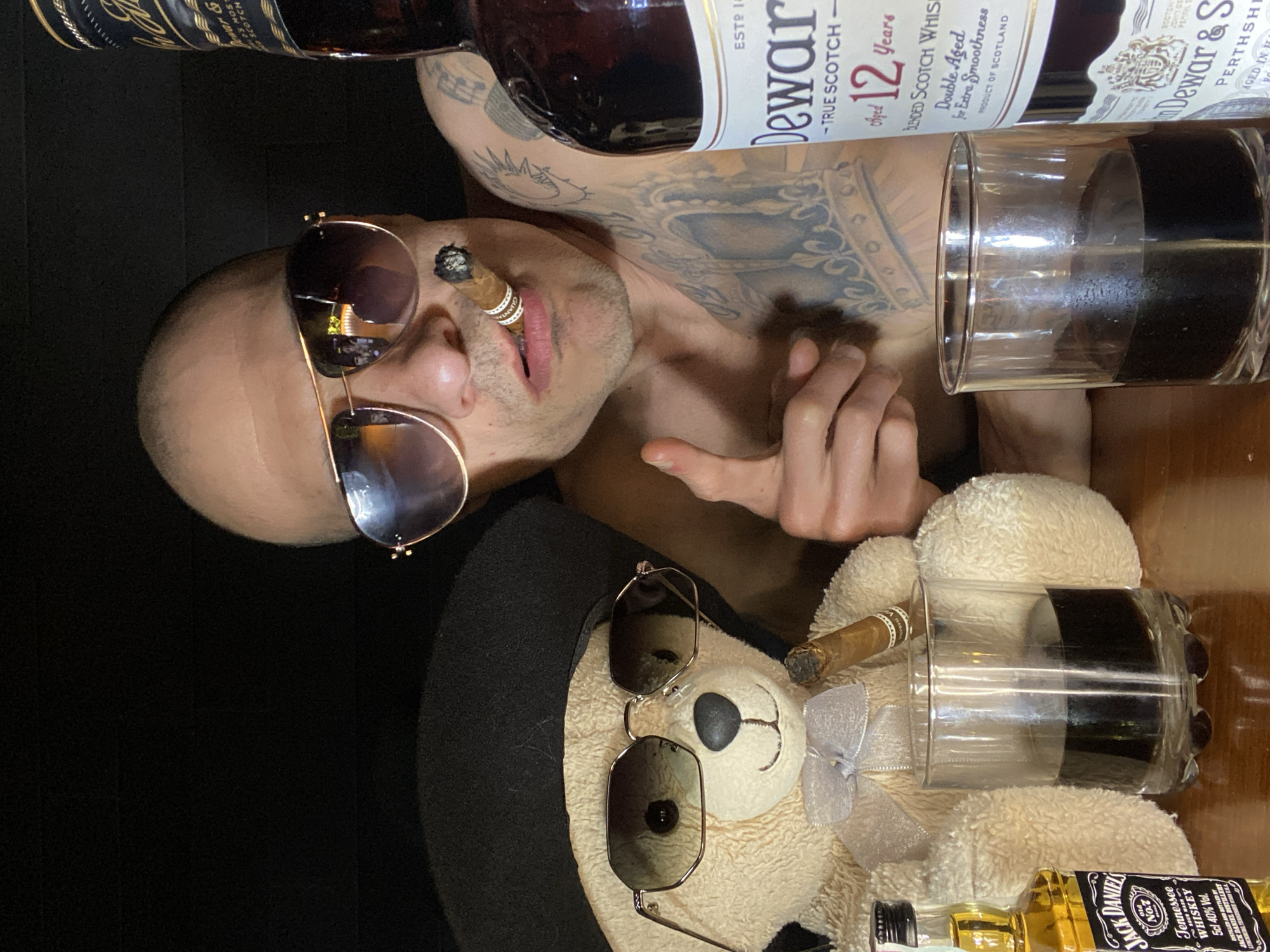Sunglasses-wearing teddy bear posed with muscular arms in Pleven