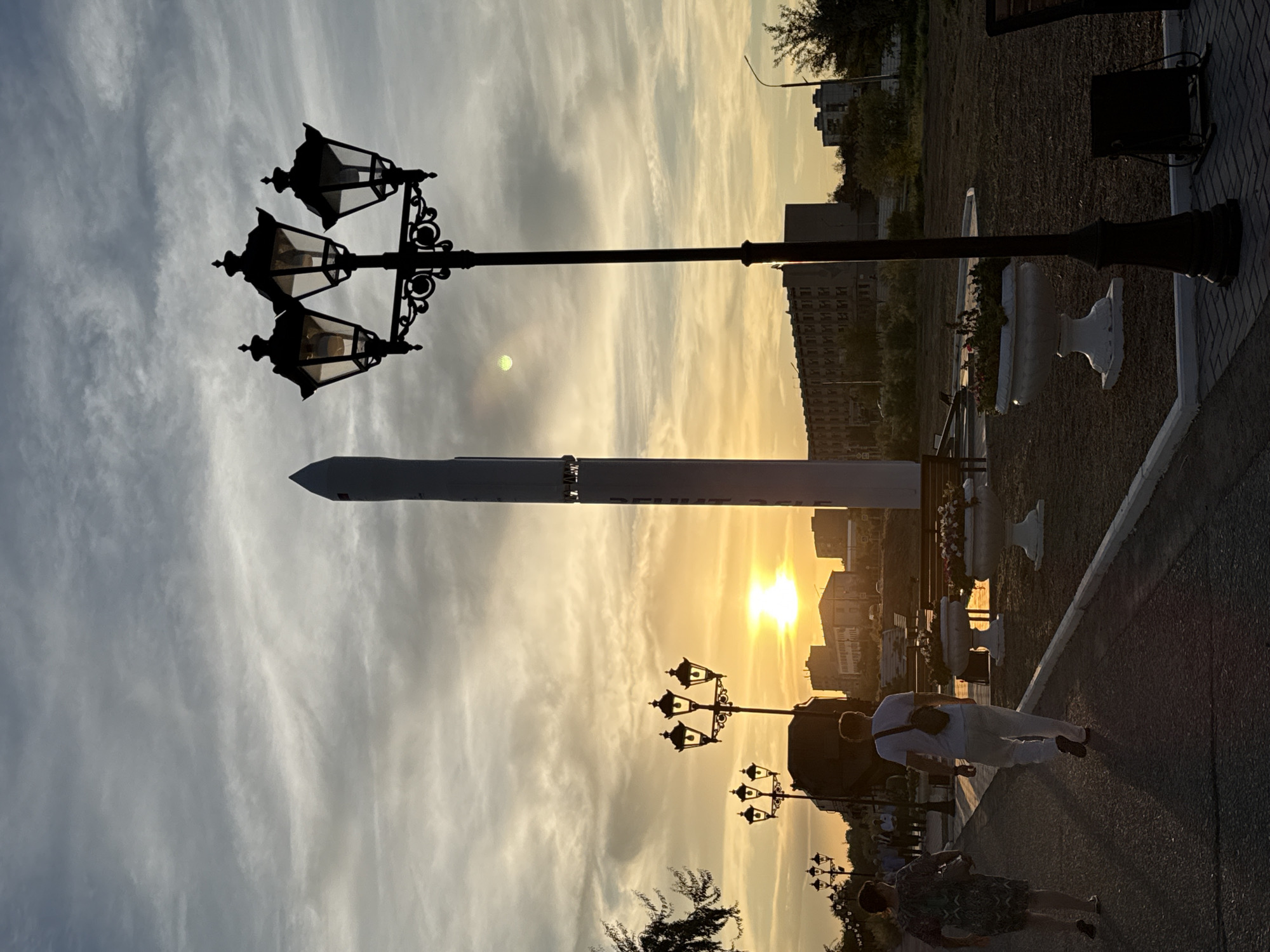 Baikonur at golden hour: rocket monument and park paths