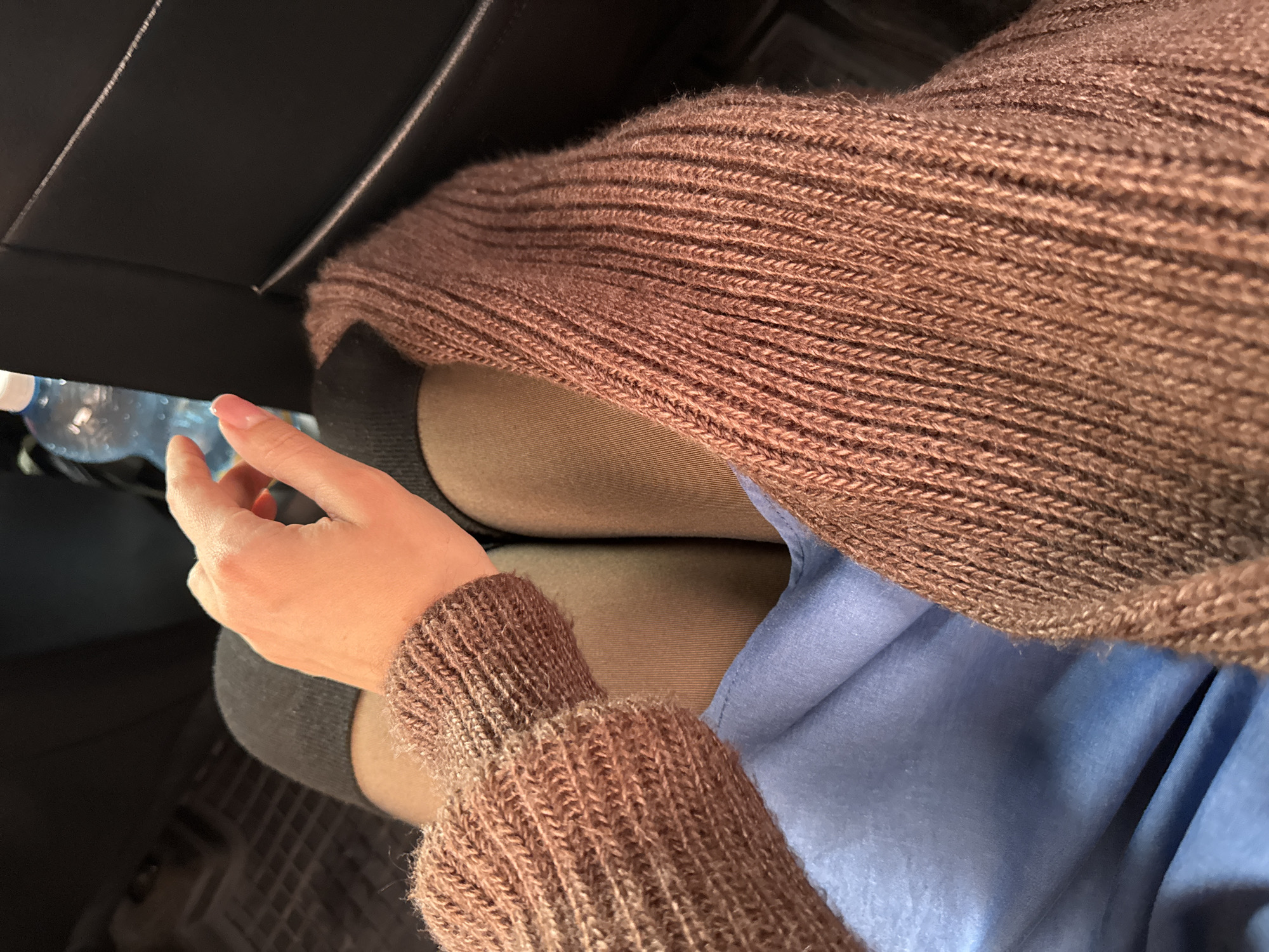 Person in brown sweater observed in car in Kryvyi Rih
