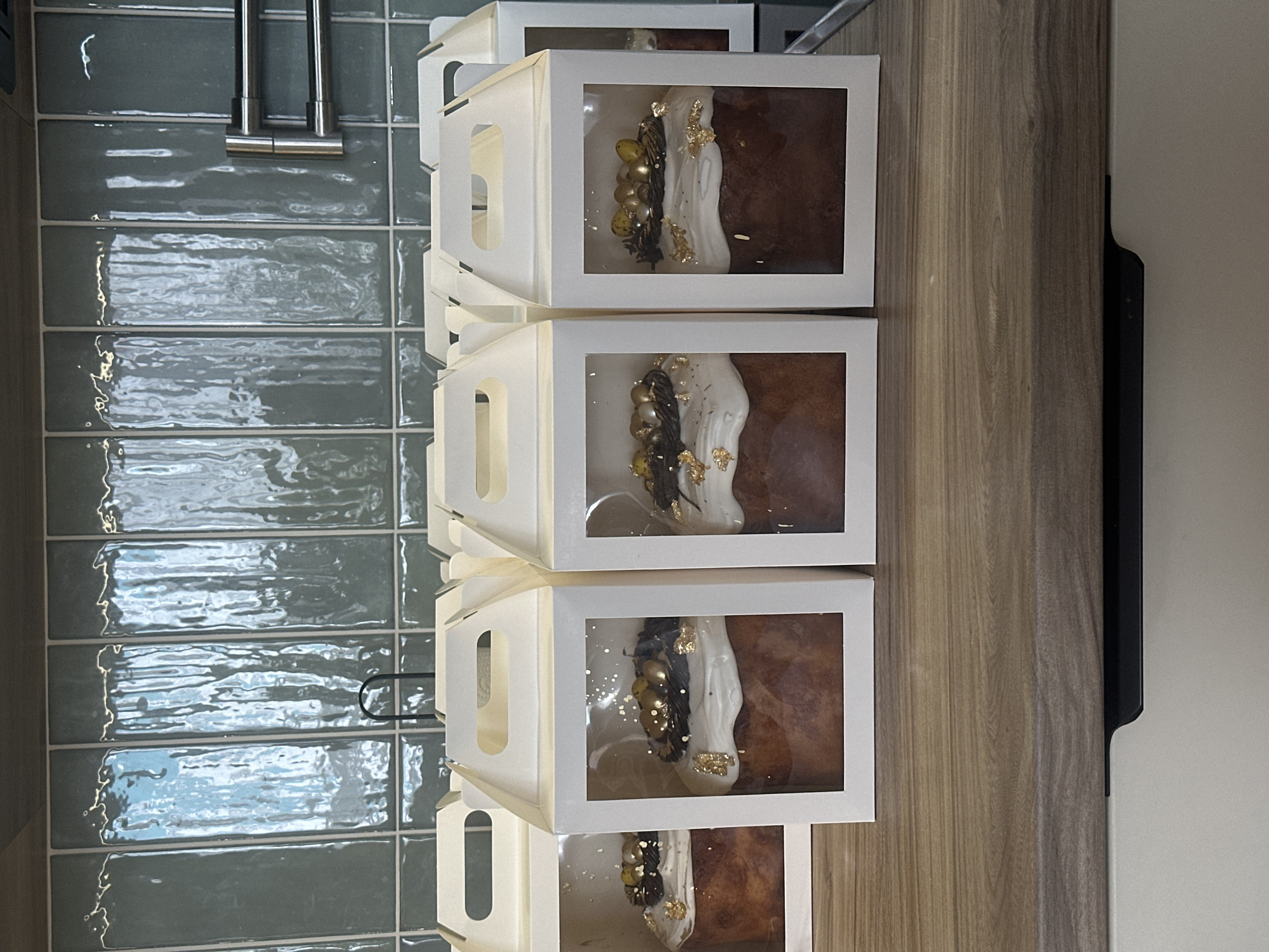 Ornate decorated cakes displayed in Krasnoyarsk bakery or shop