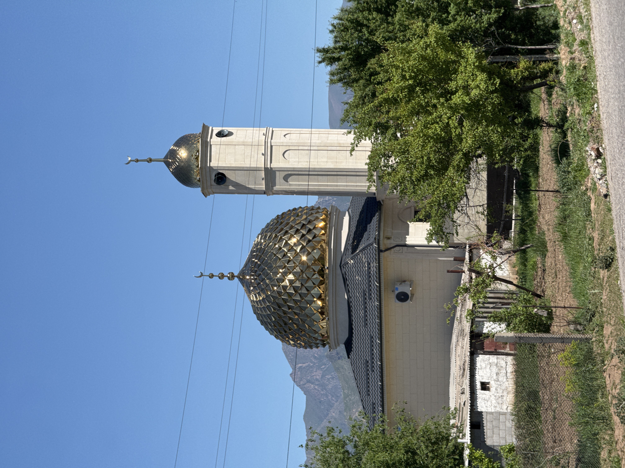 Mosque photographed under clear skies in Tokmok, Kyrgyzstan