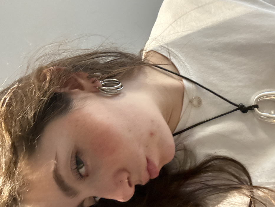 Young woman documents afternoon selfie session in Hull residence