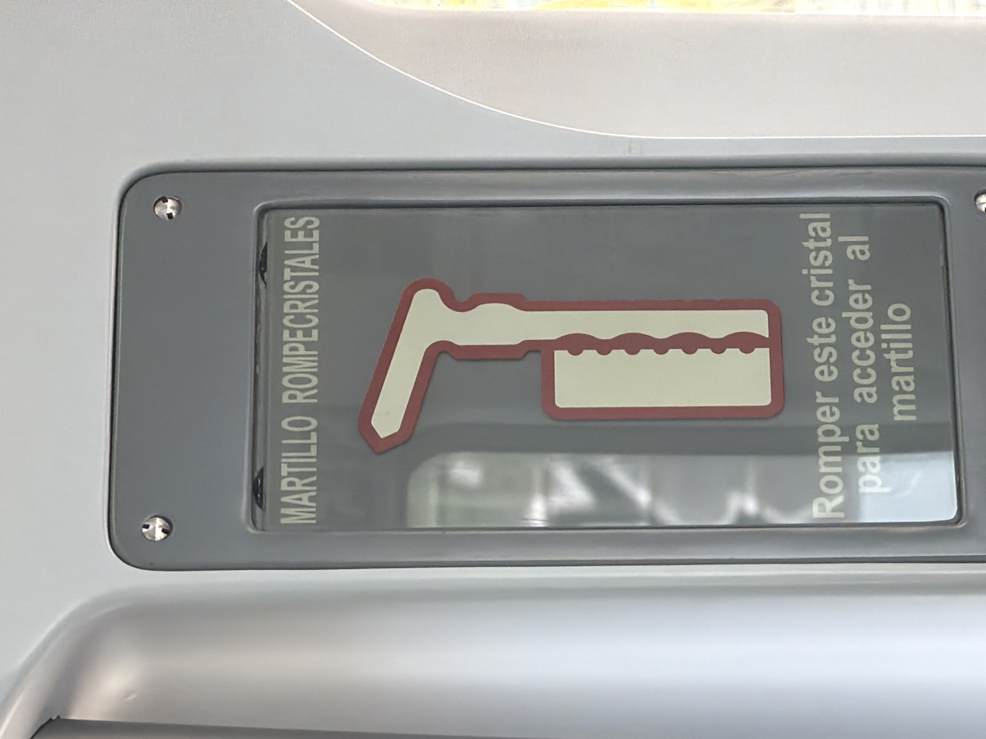 Emergency hammer safety sign spotted in Madrid vehicle