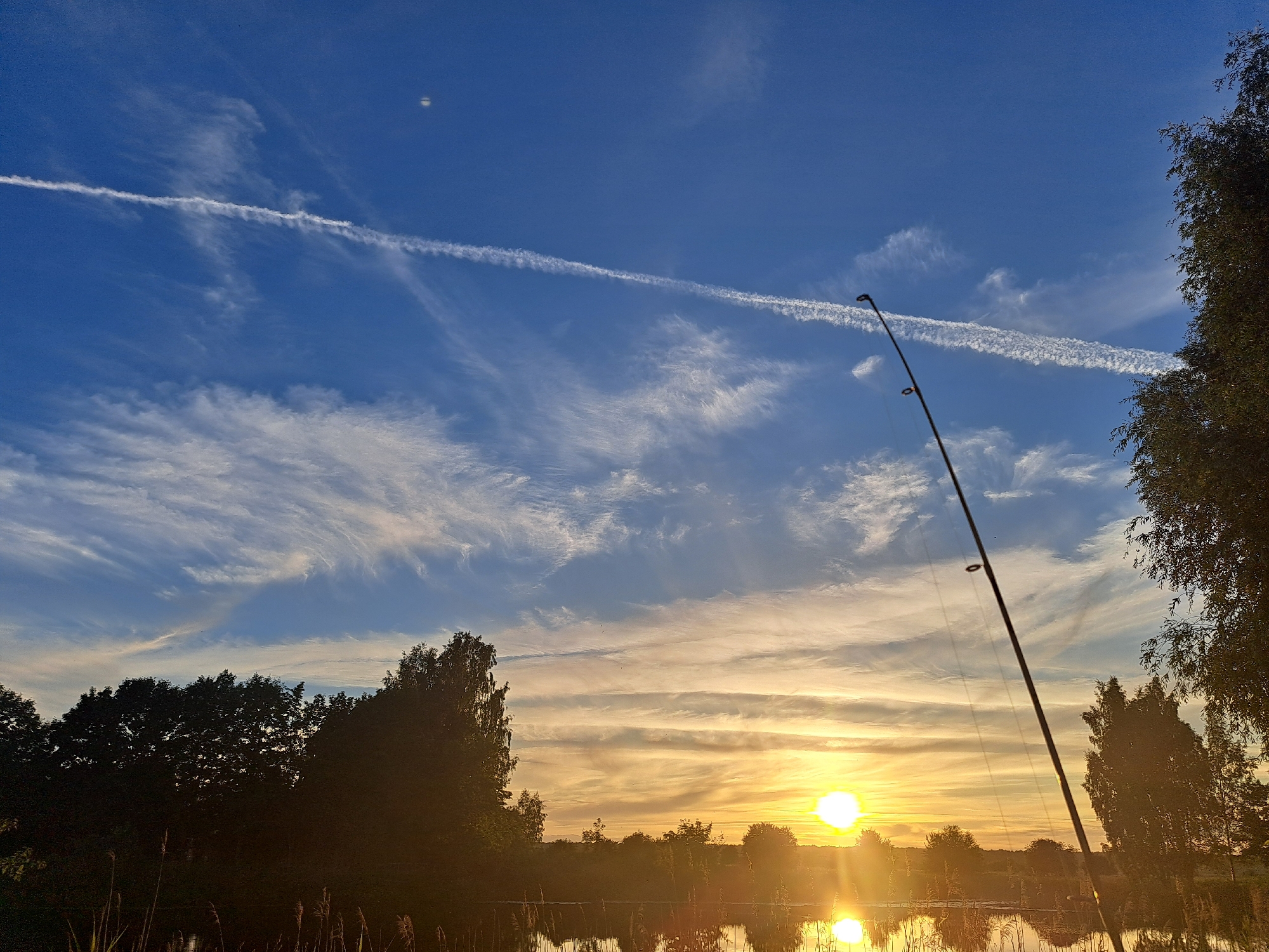 Summer evening cookout and hangout by a Riga lakeside park