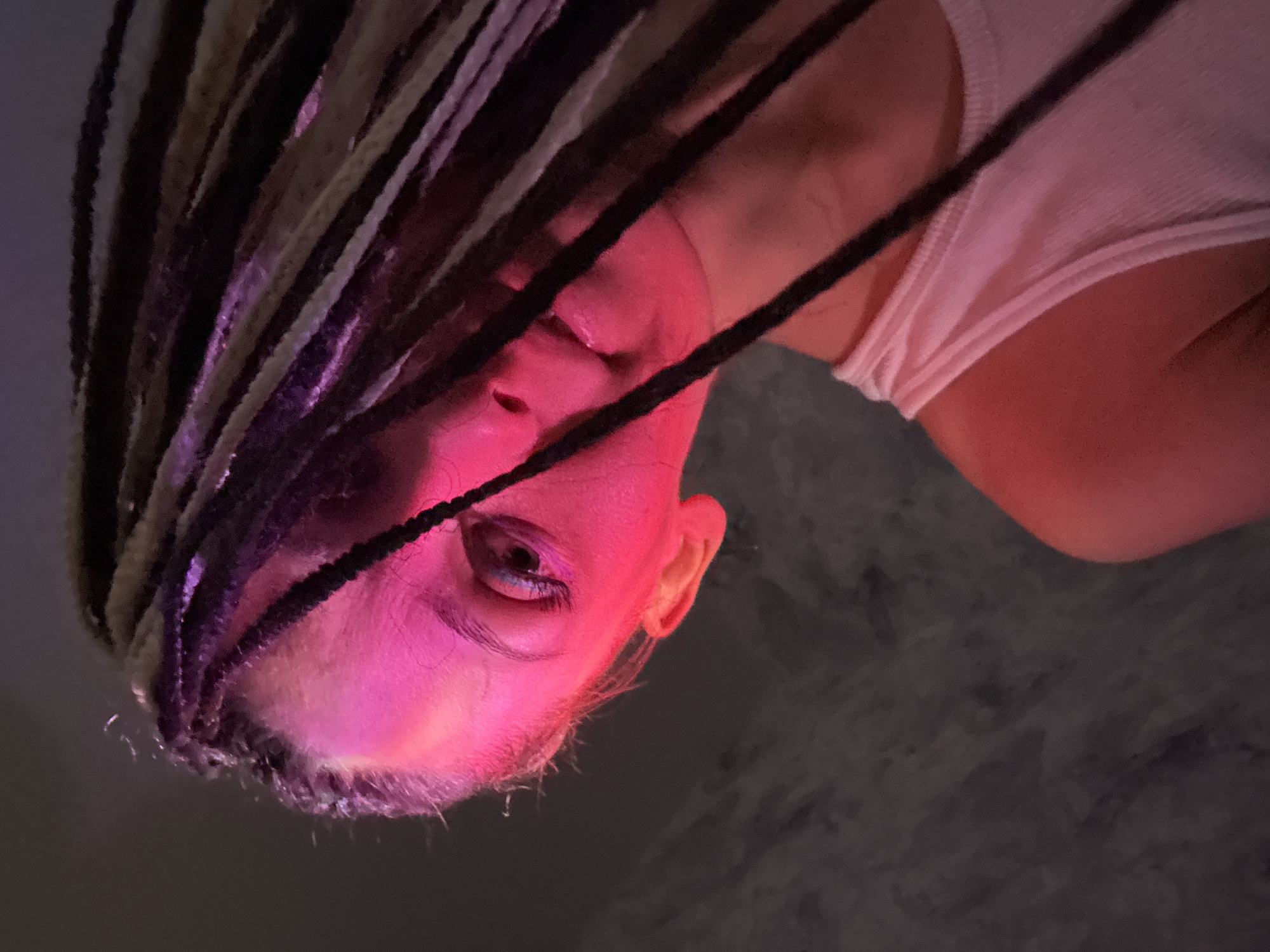 Person with braided hair photographed in Rusanovo, Russia