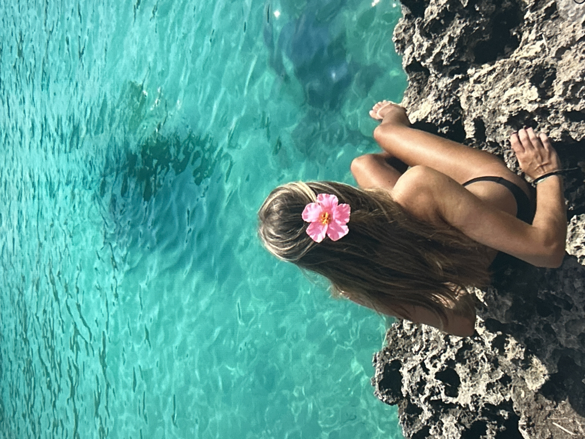 Coastal scene with turquoise waters and historic buildings documented