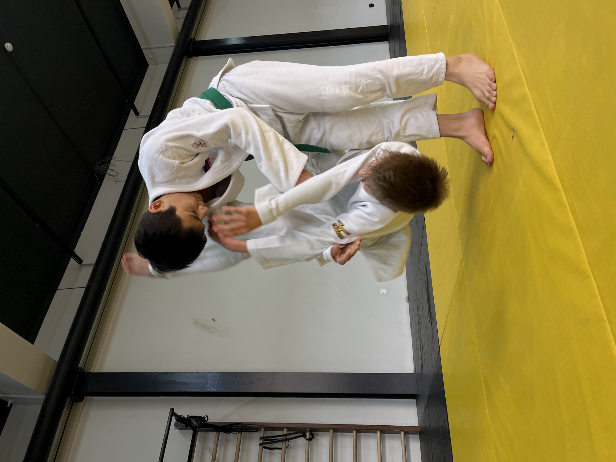 Young judoka practice throws during early morning training in Krasnoyarsk