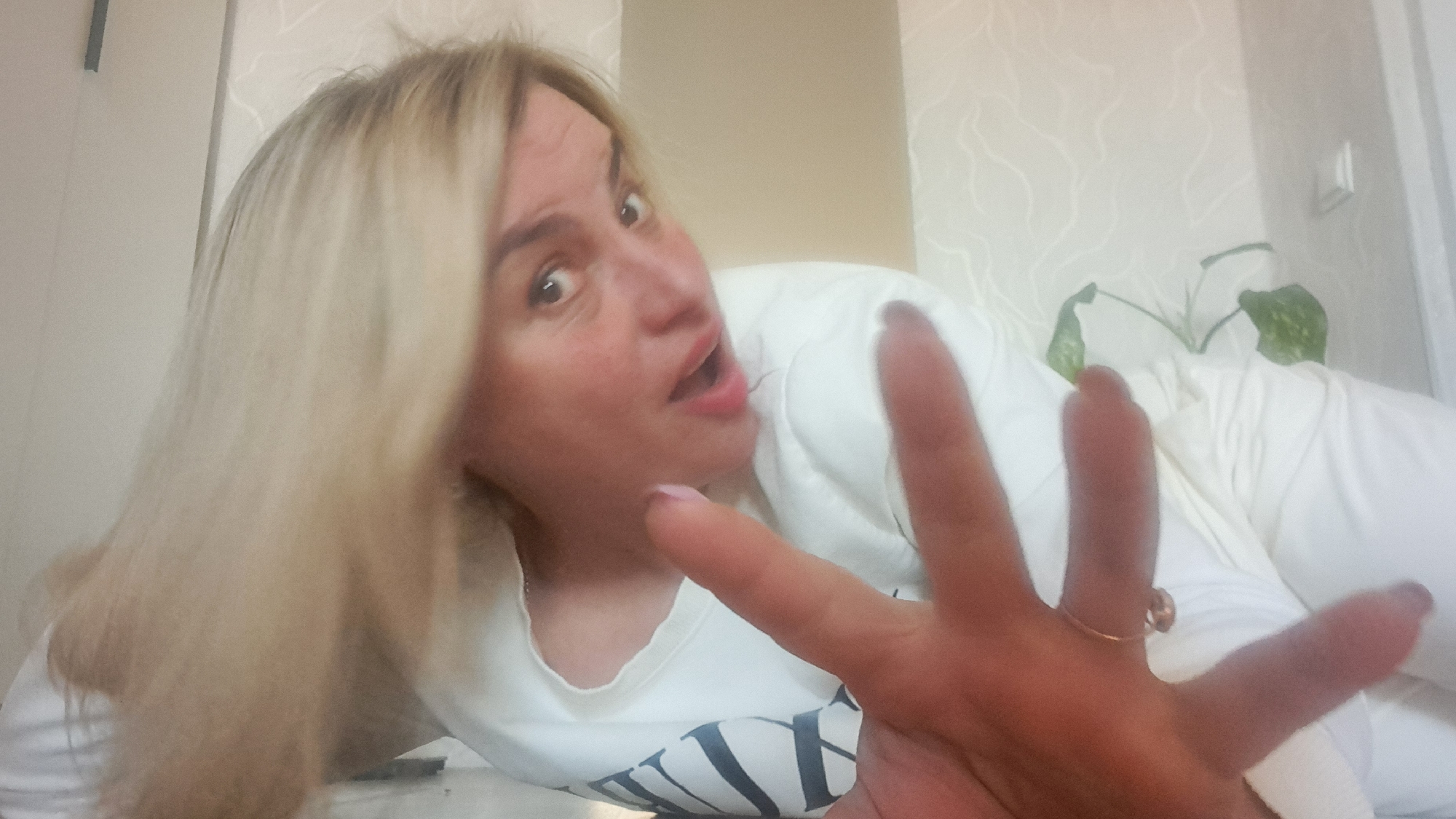 Woman takes multiple selfies while lying down in Russia