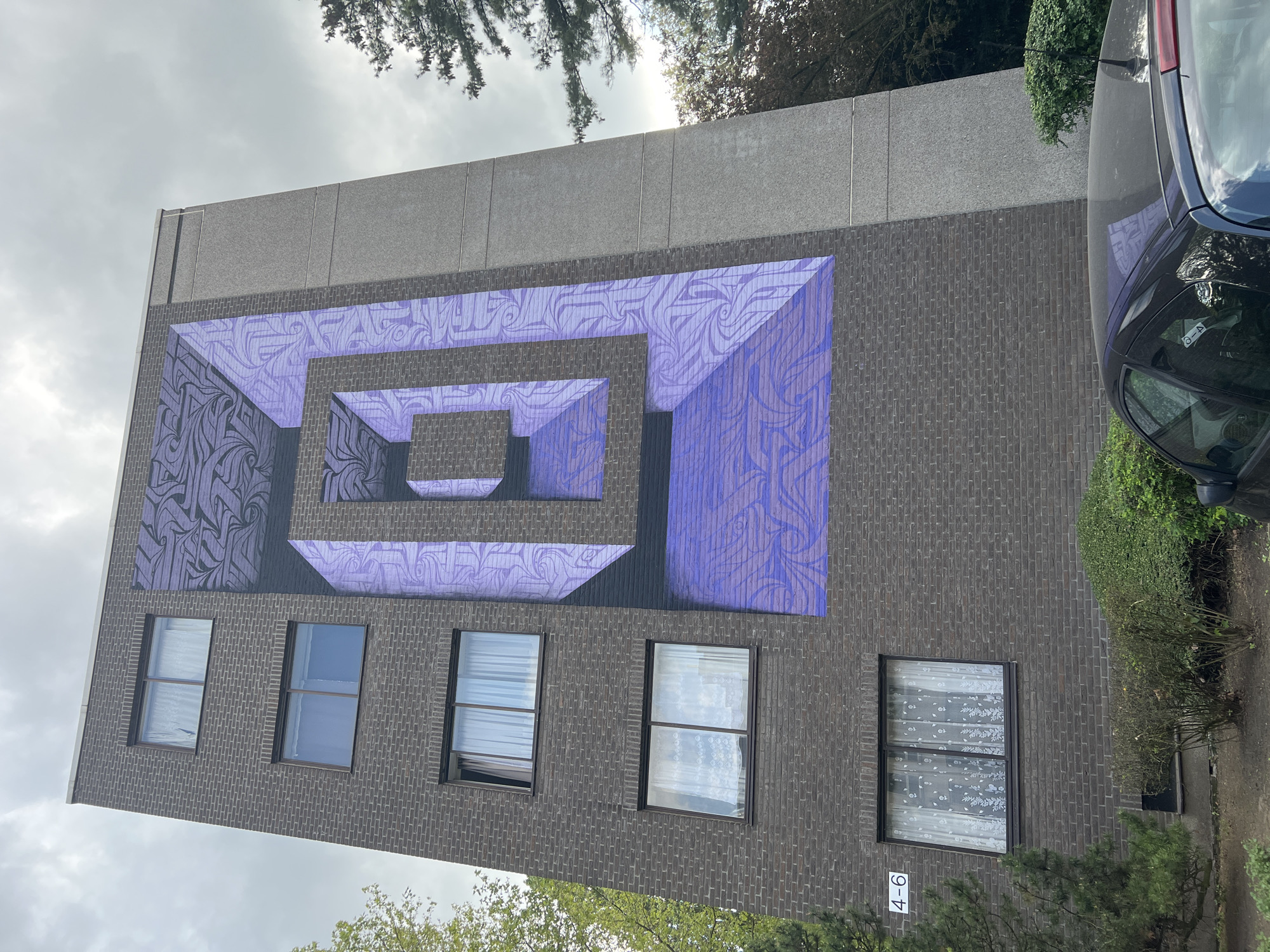 Purple murals spotted on Antwerp residential buildings