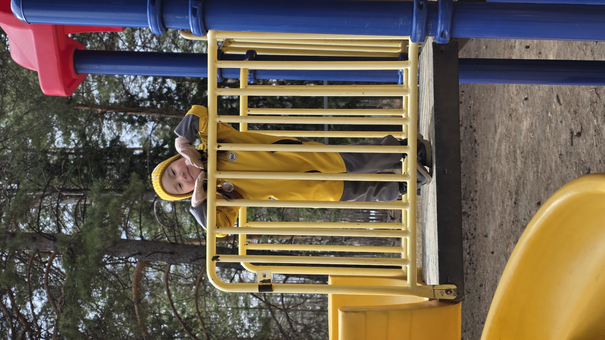 Child plays at playground, memorial complex documented in Lensk