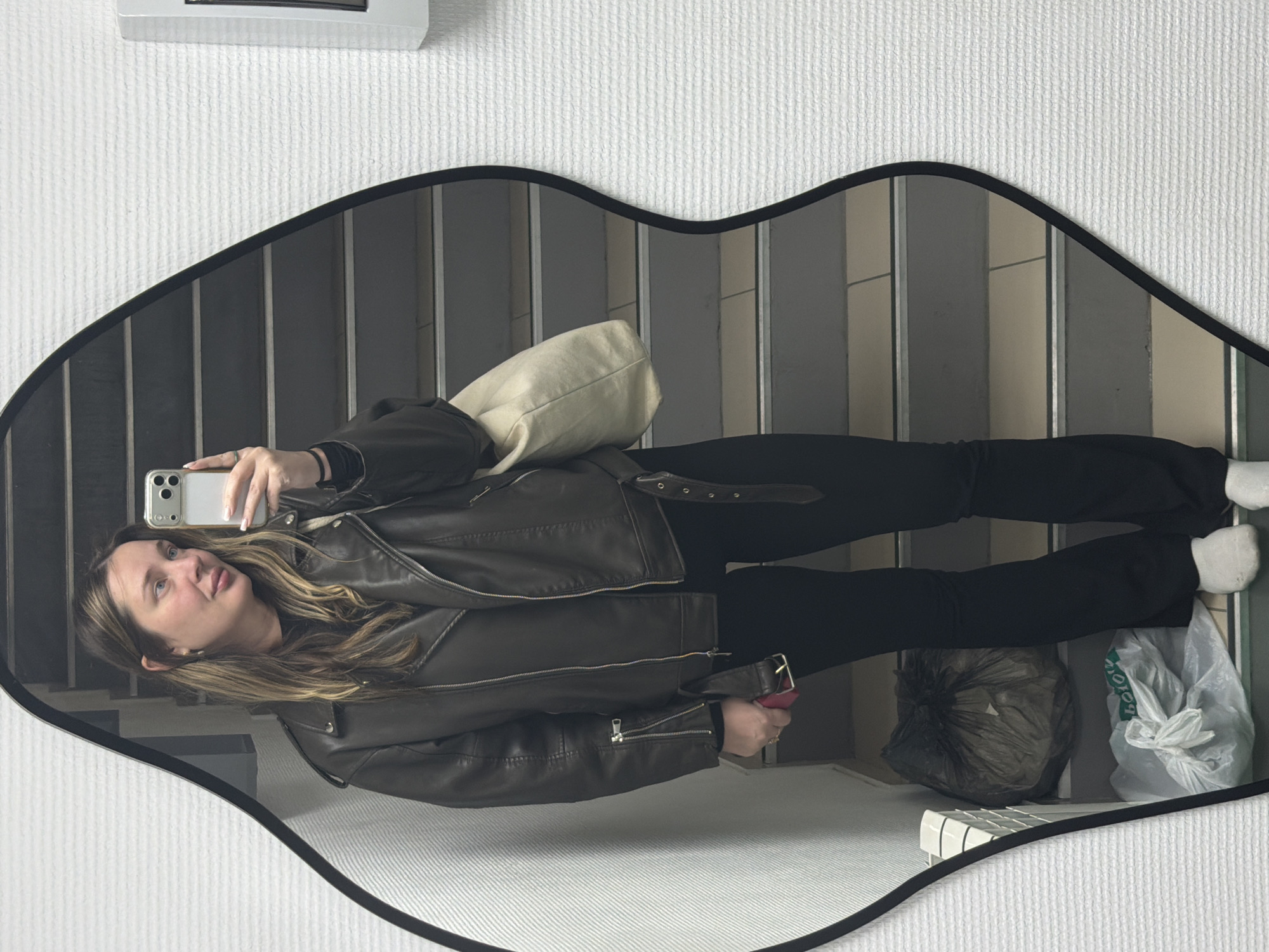 Woman takes multiple selfies at hair salon in Chaikovsky