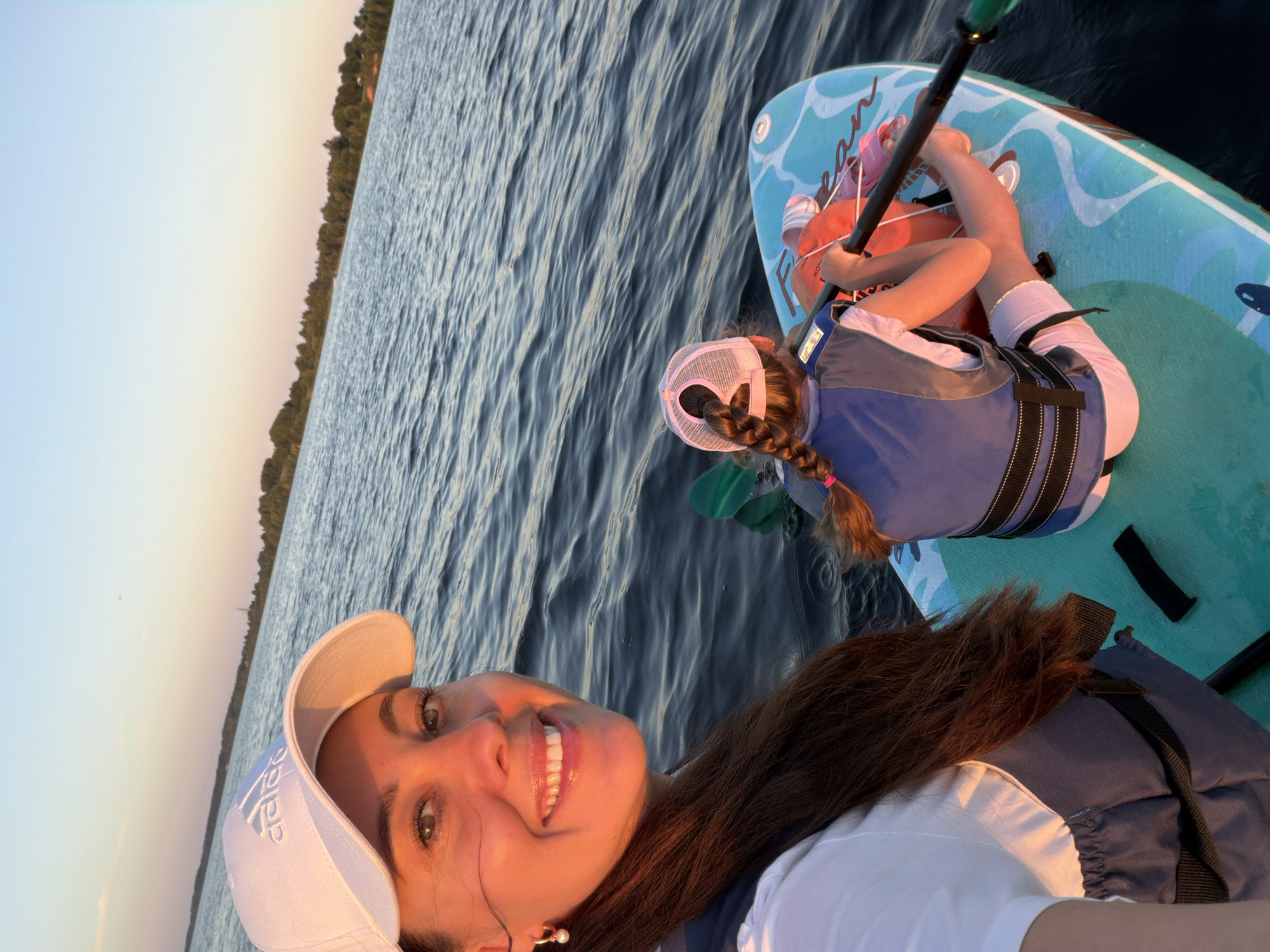 Paddleboarding on a Latvian lake on a June evening
