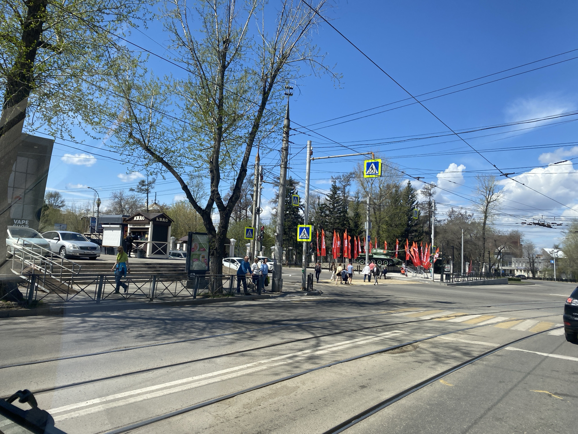 Daily street life documented along Irkutsk tram lines