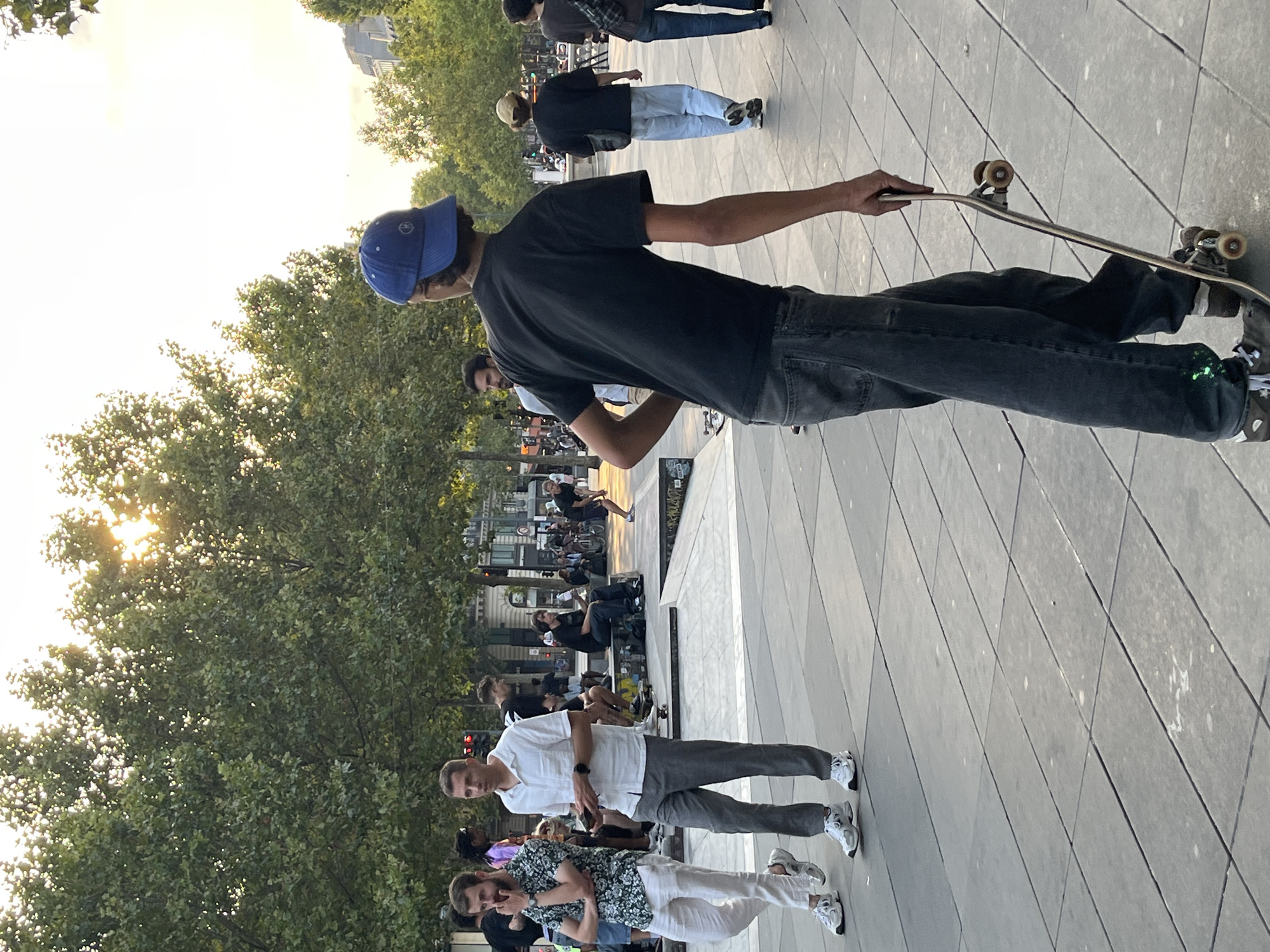 Casual afternoon in a Parisian plaza, toys and lamppost curiosities