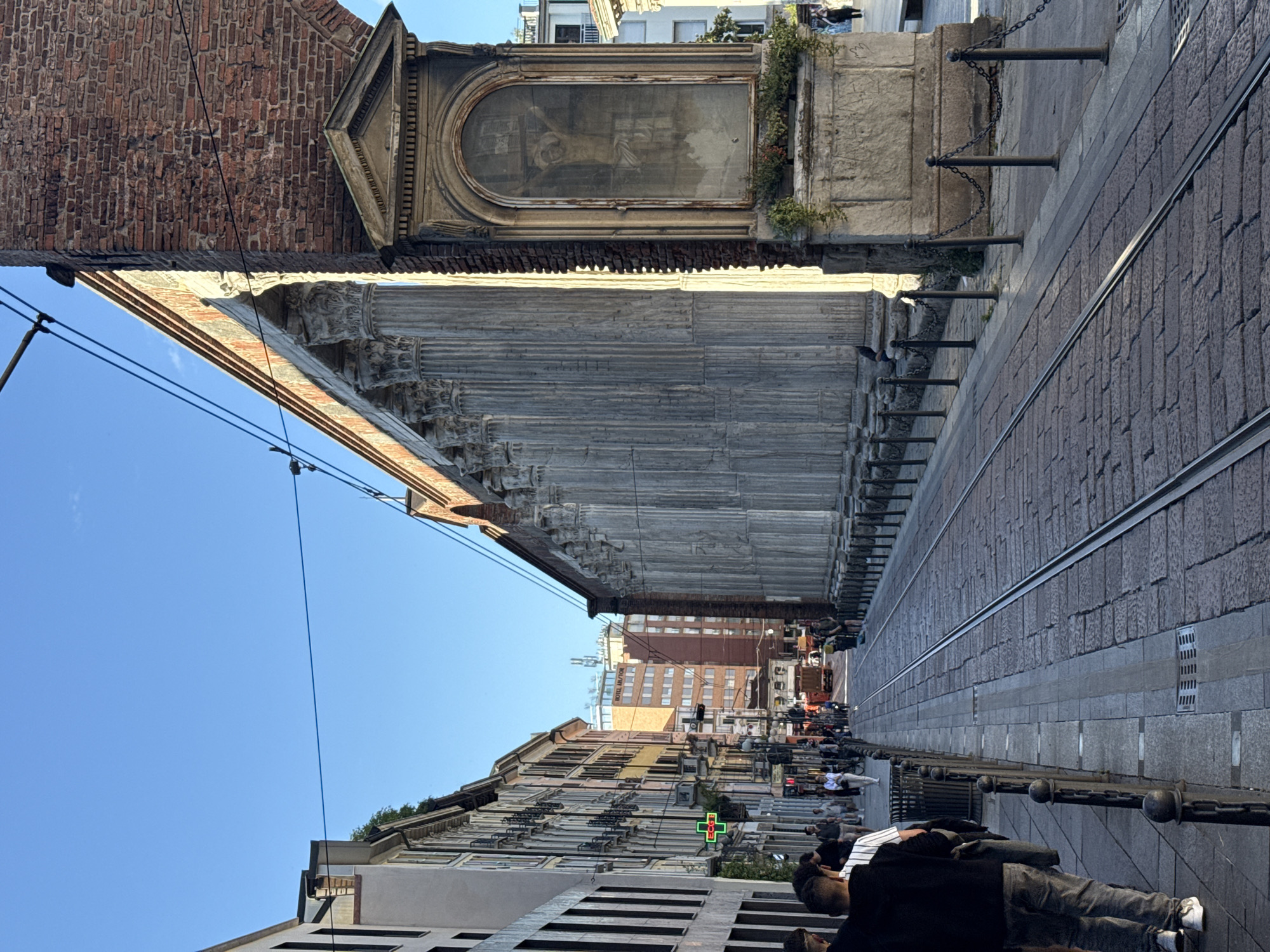 Milan street scene with columns documented by witness