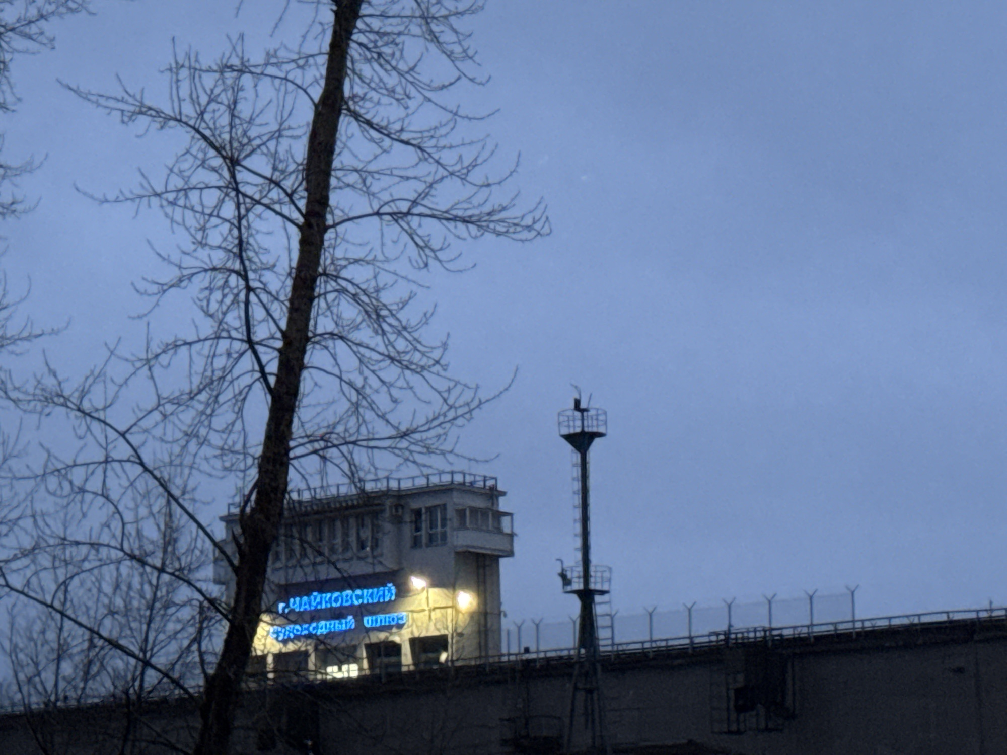 Twilight industrial scene documented at Chaikovsky lock system, Russia