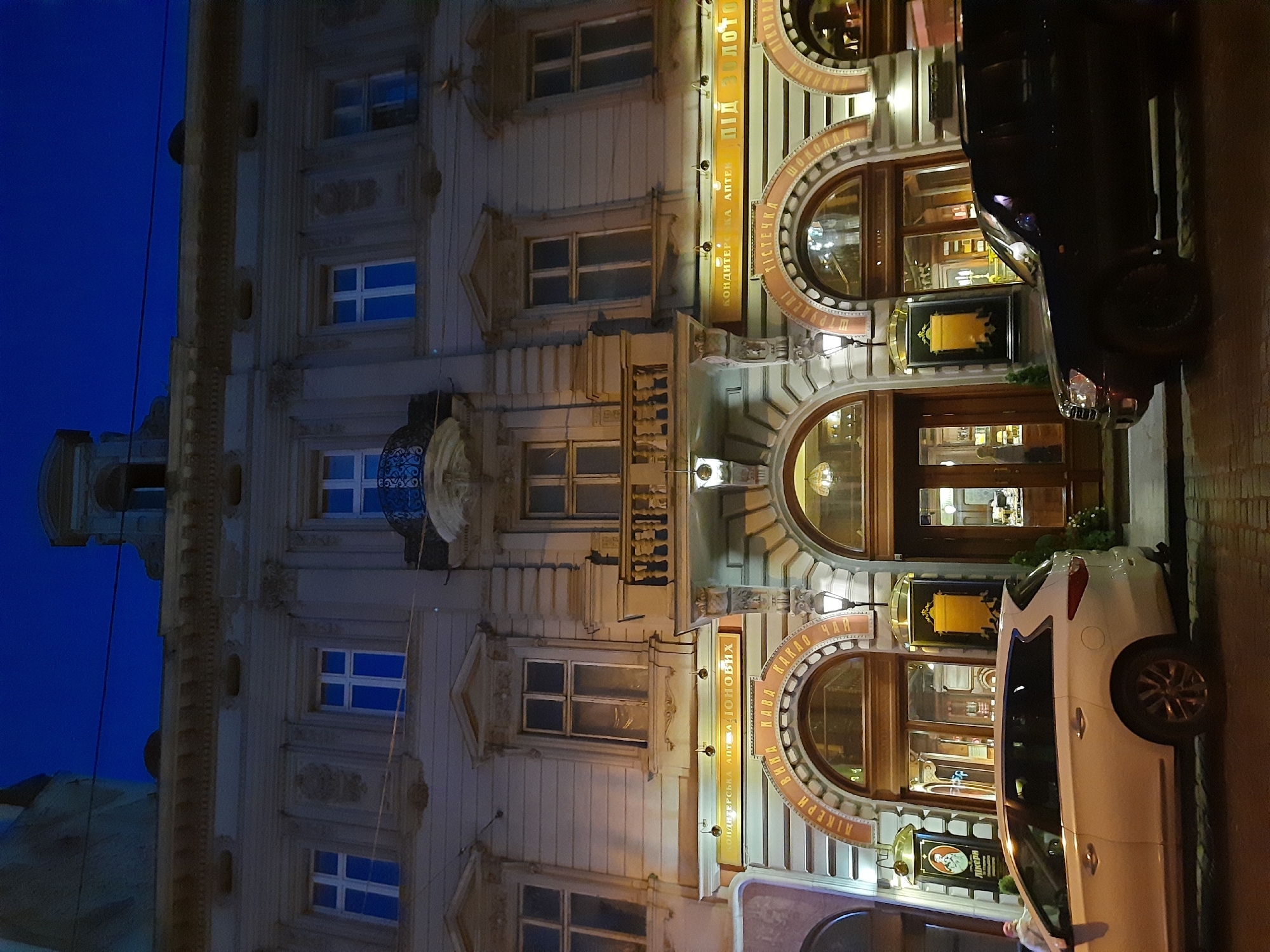 Ornate Lviv building glows at dusk
