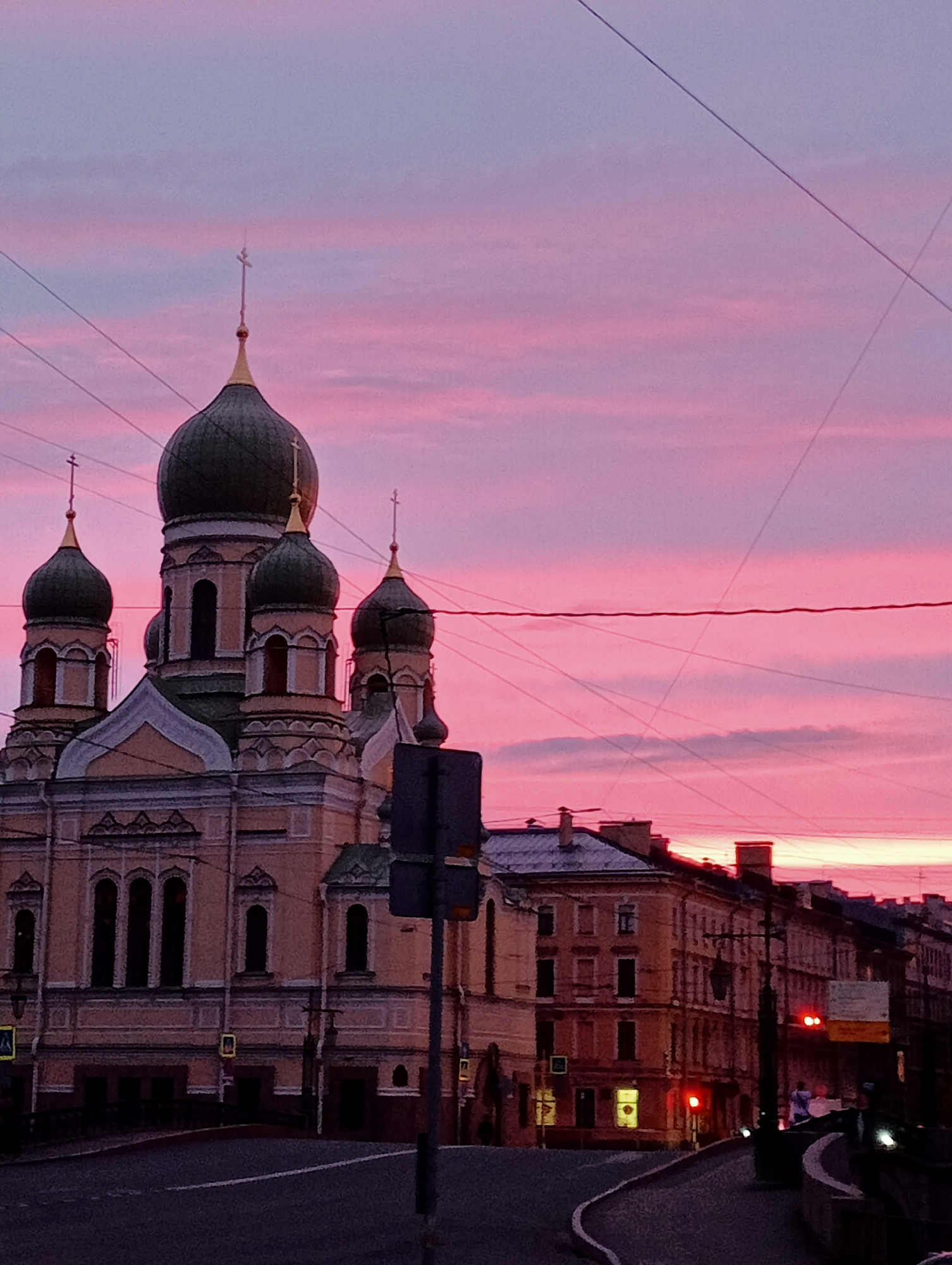 Saint Petersburg streets and skyline glow under a summer sunset