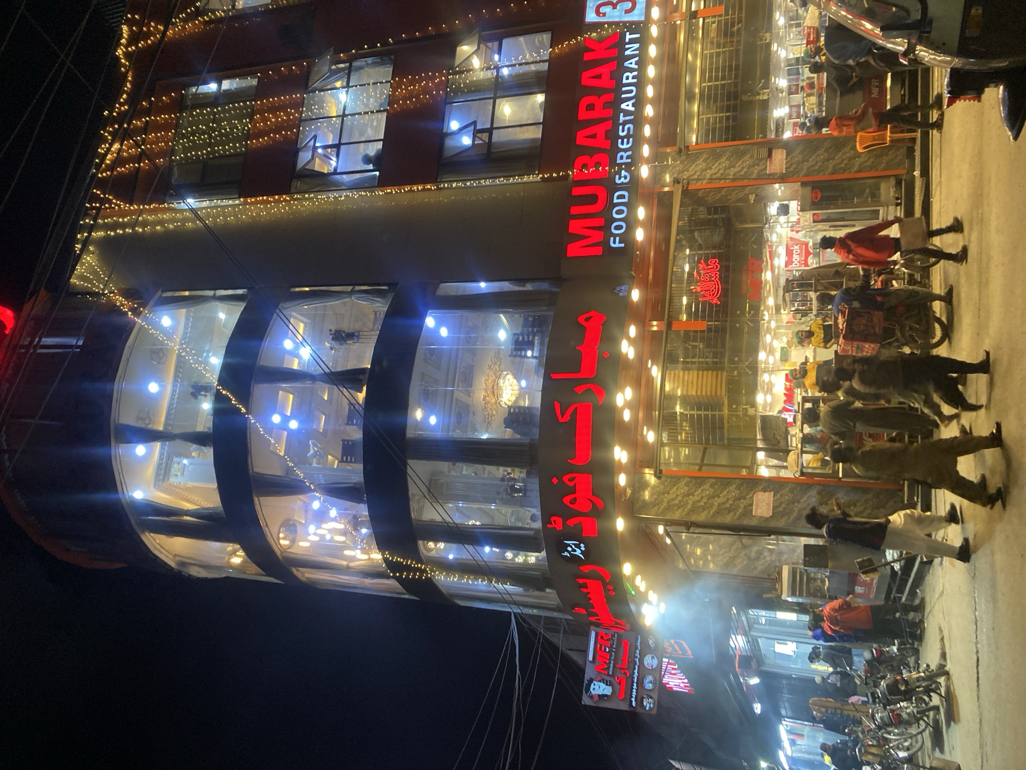 Restaurant displays bright decorative lighting in Quetta, Pakistan