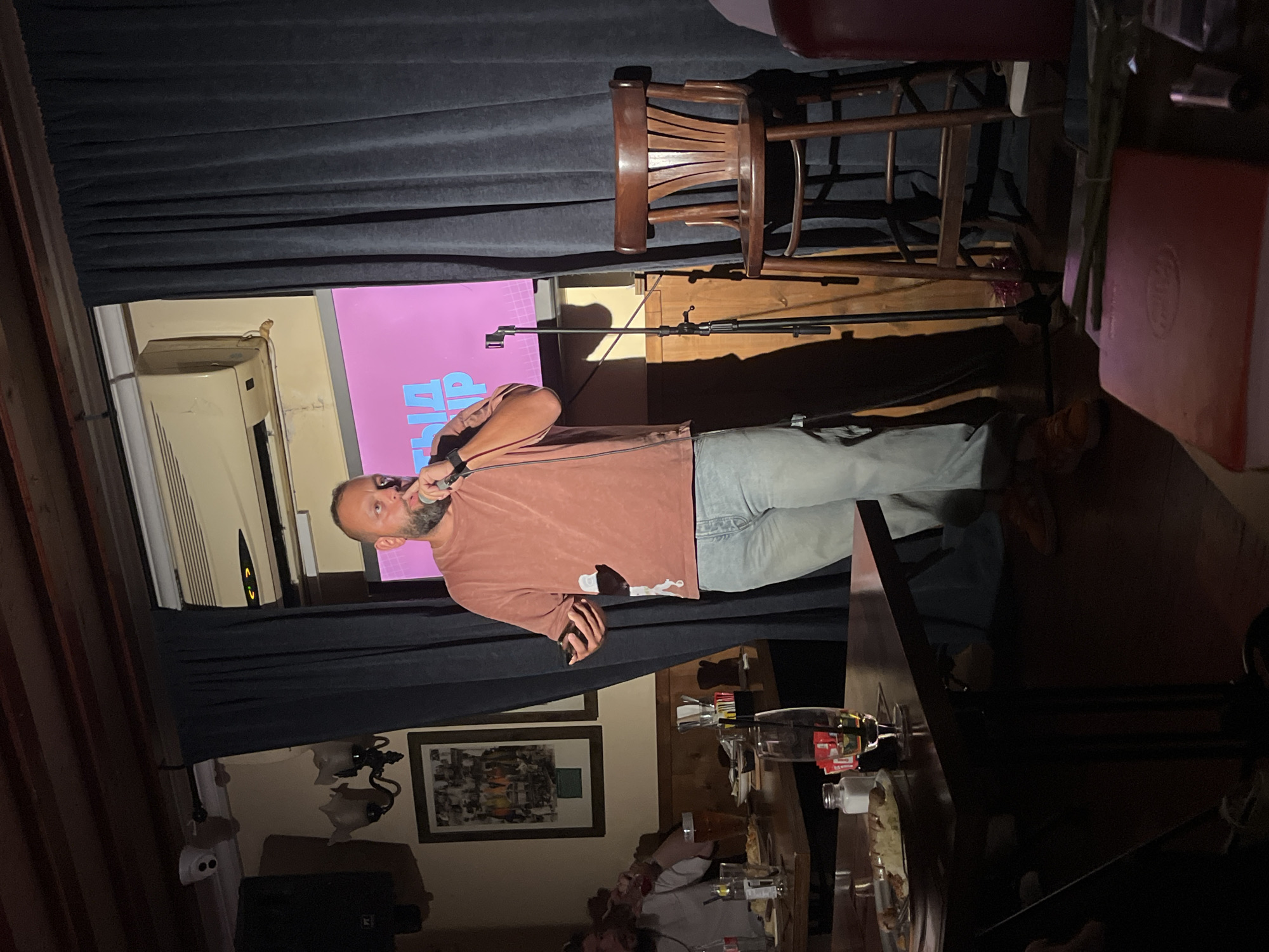 Comedian performs on stage in Tel Aviv entertainment venue