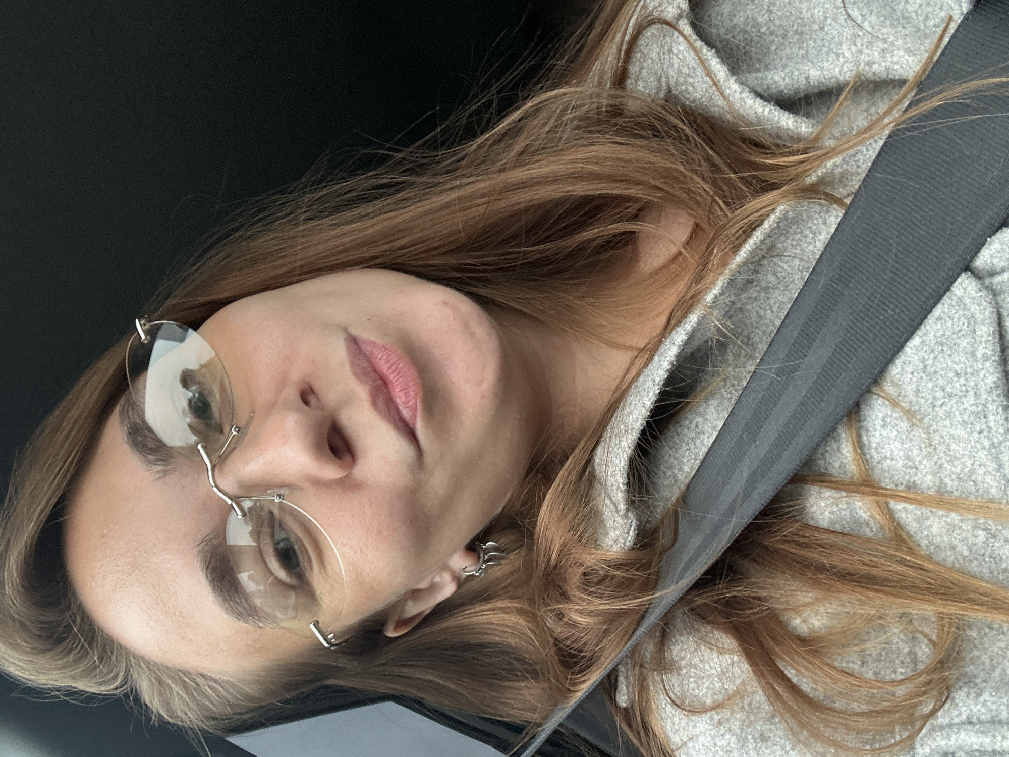 Close-up portrait with rimless glasses in Prikamsky, Russia