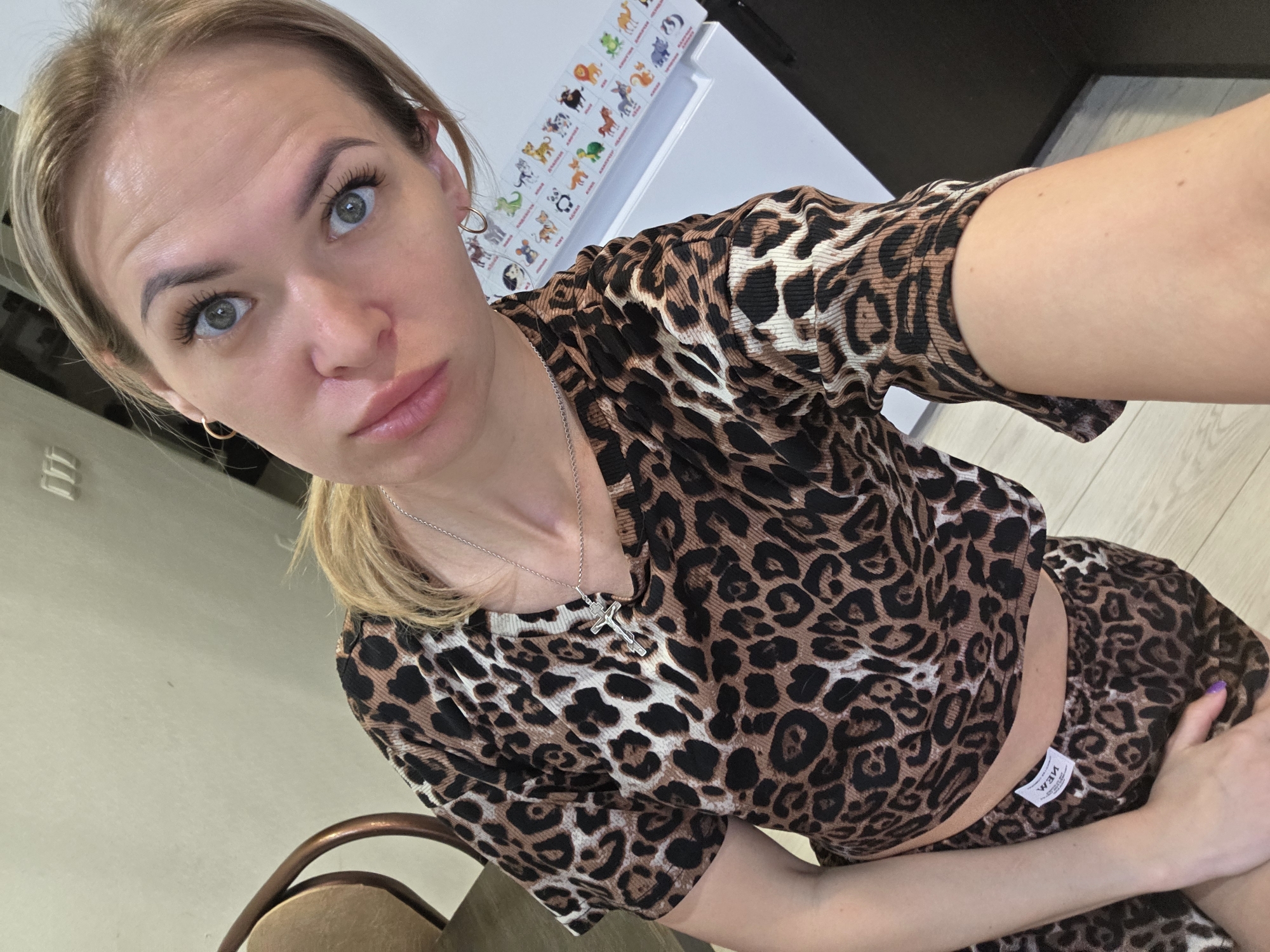 Woman takes selfie among houseplants in Chaikovsky home