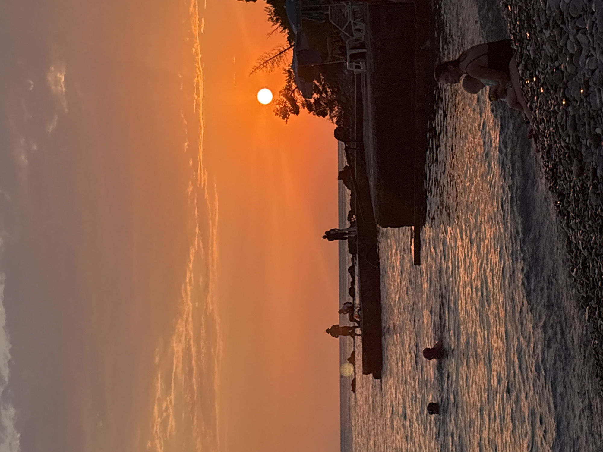 Sunset and beach life on the Adriatic coast in Bar, Montenegro