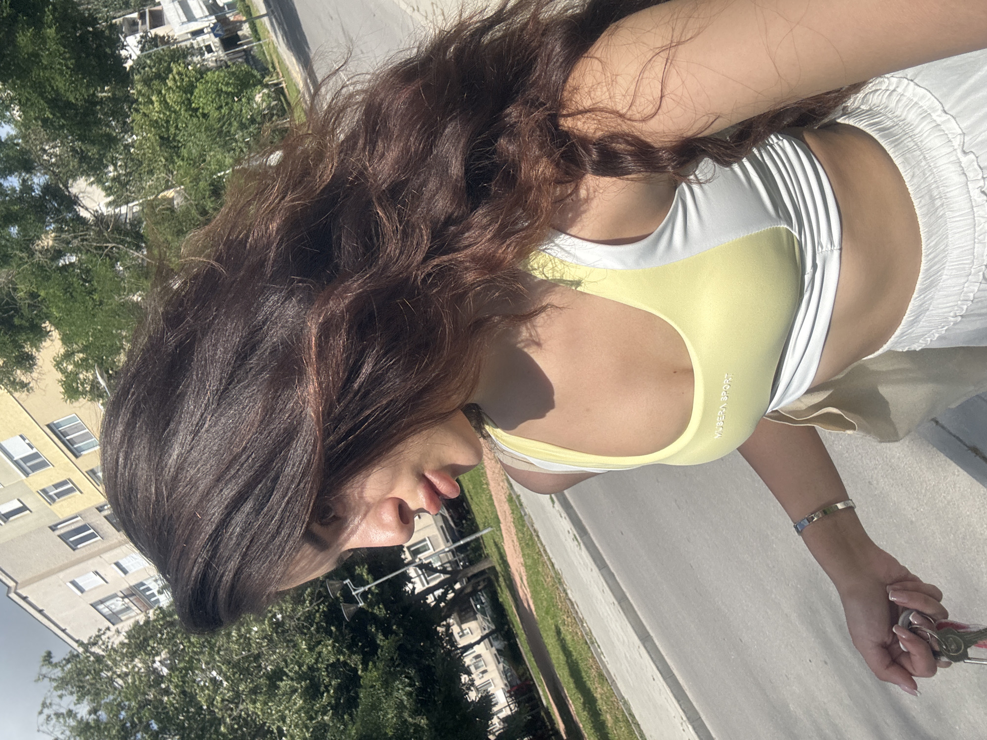 Woman photographed walking through Plovdiv city center in afternoon