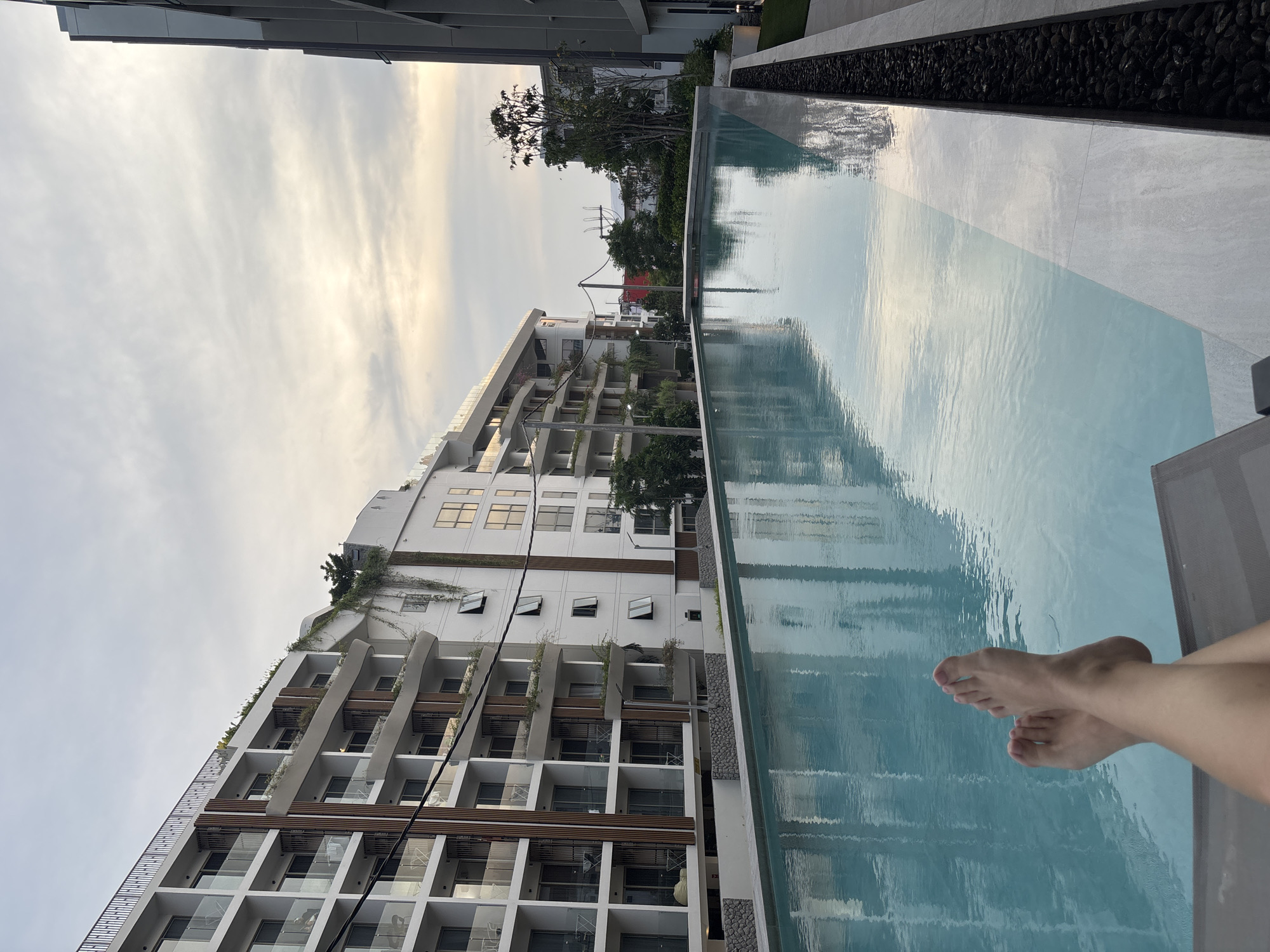 Resort swimmer documented during morning pool session in Thailand
