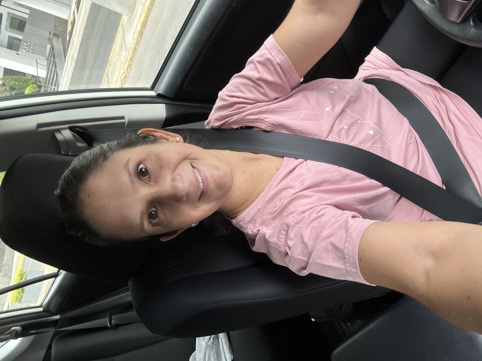Woman takes selfies in car and elevator in Lima