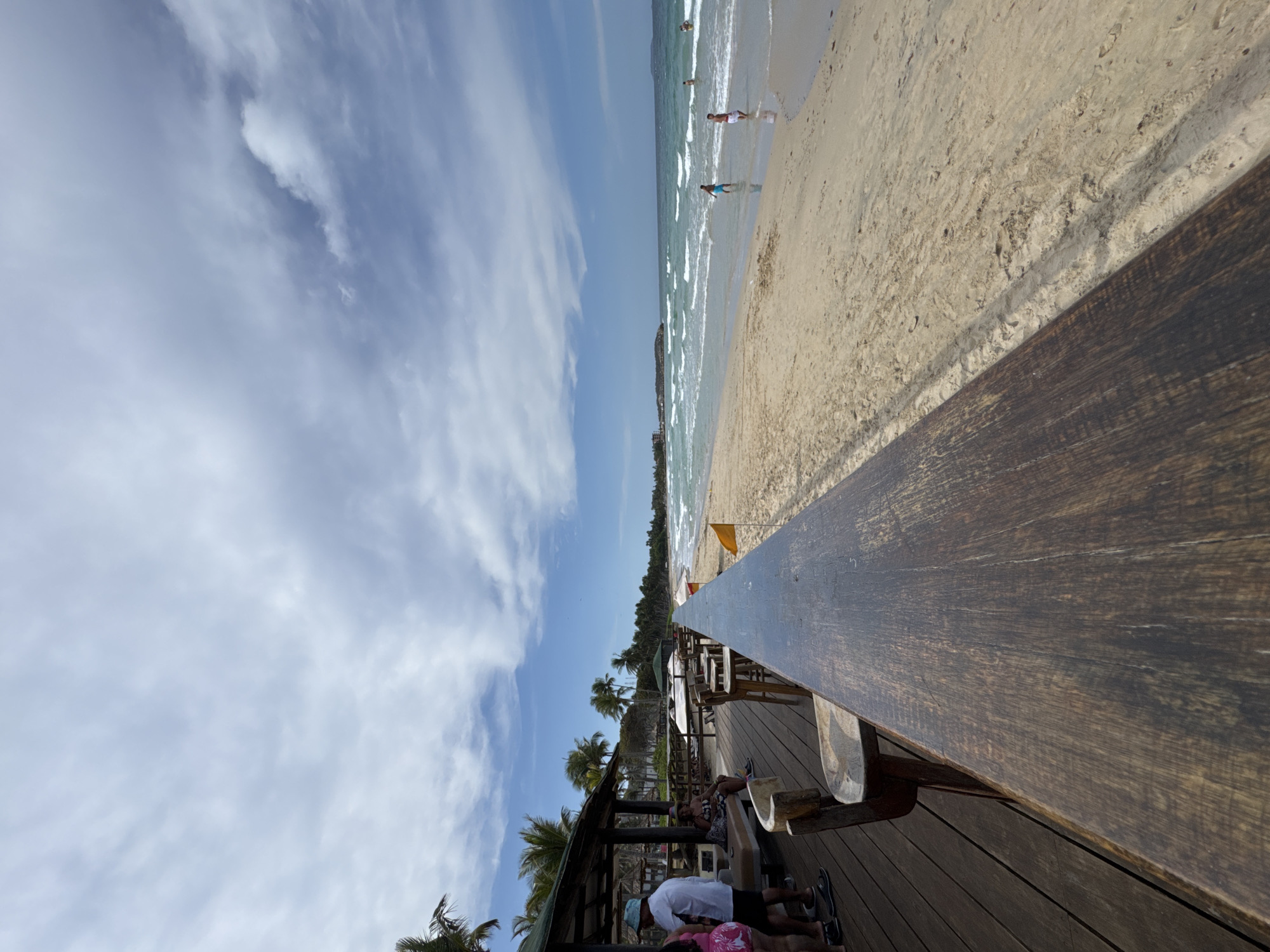 Tourist documents sunny beach vacation day in El Tirano, Venezuela