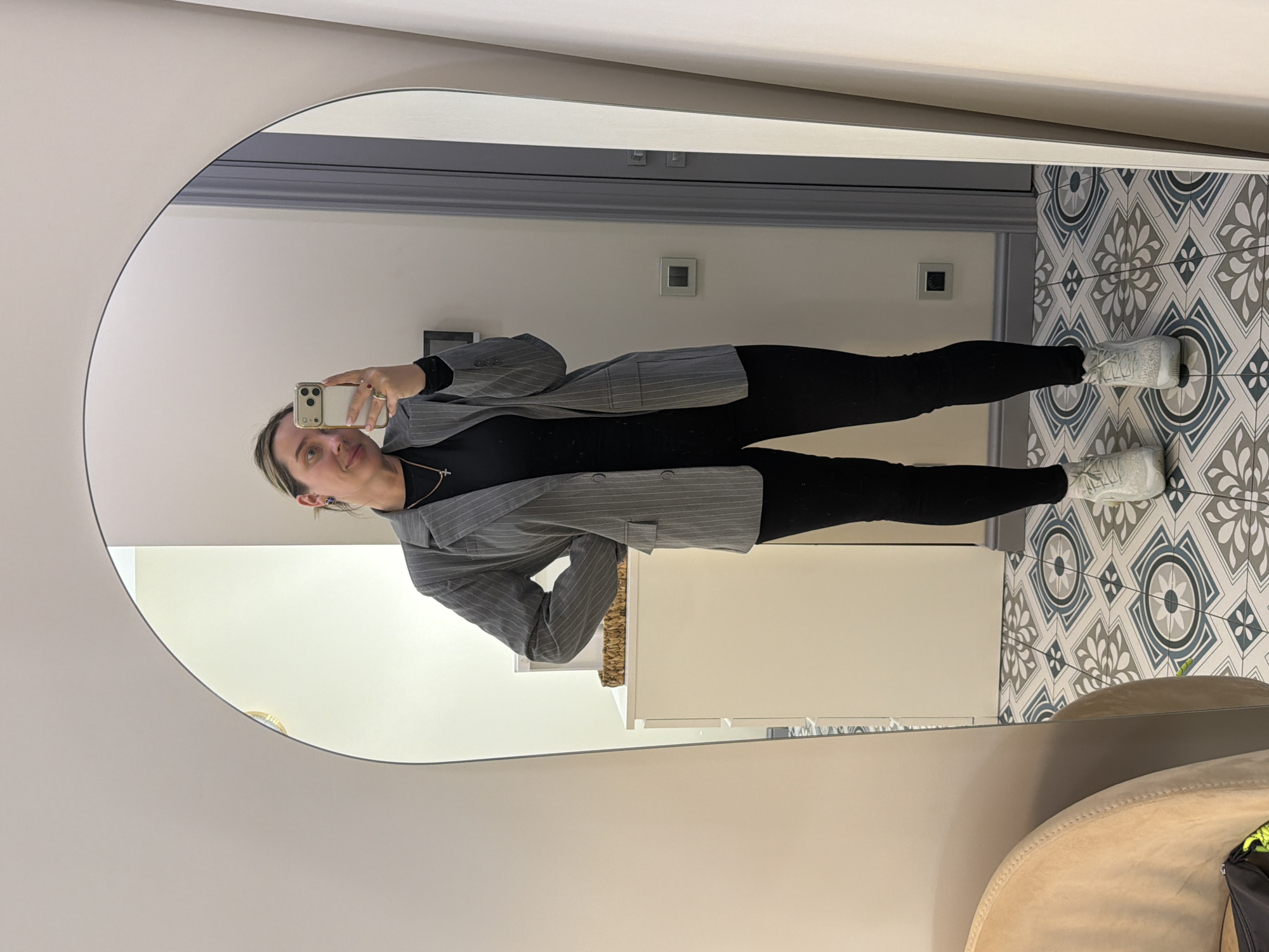 Woman takes mirror selfies in Khimki, Russia