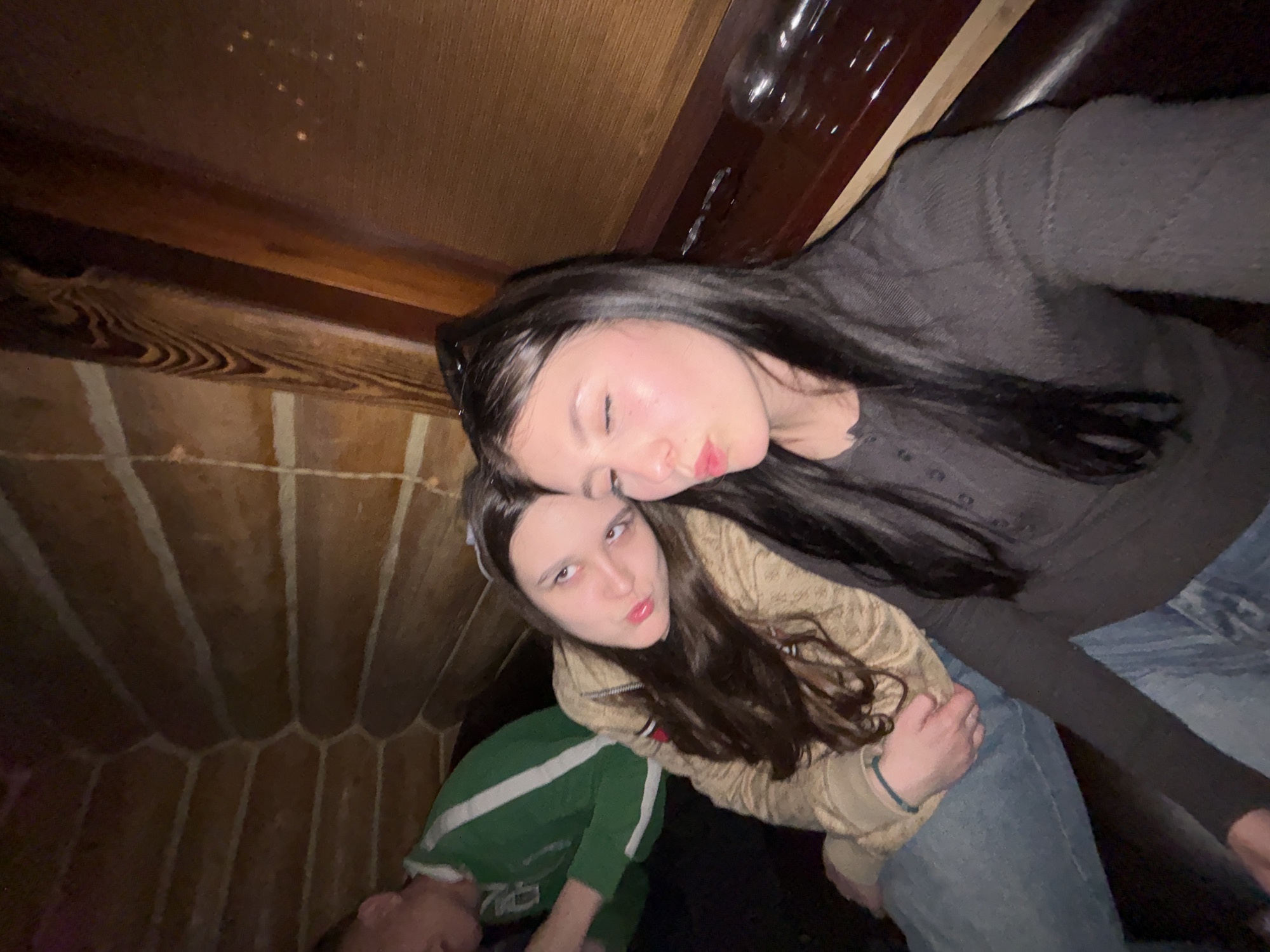 Two women photographed together in Chaikovsky interior space