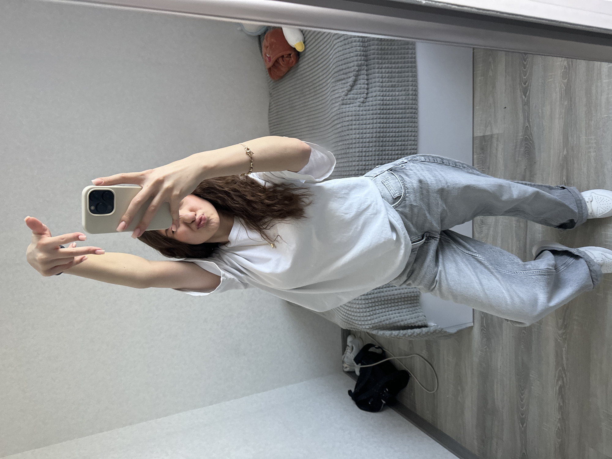 Woman takes mirror selfie in early morning Yerevan