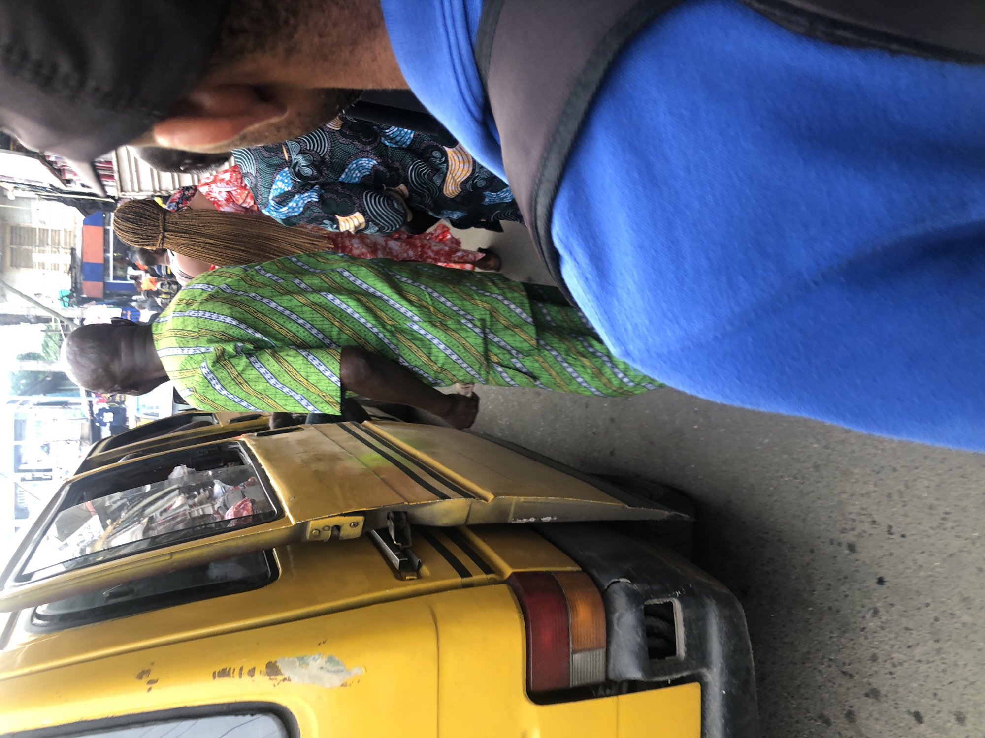 Foot traffic and street commerce along a road in Ikeja